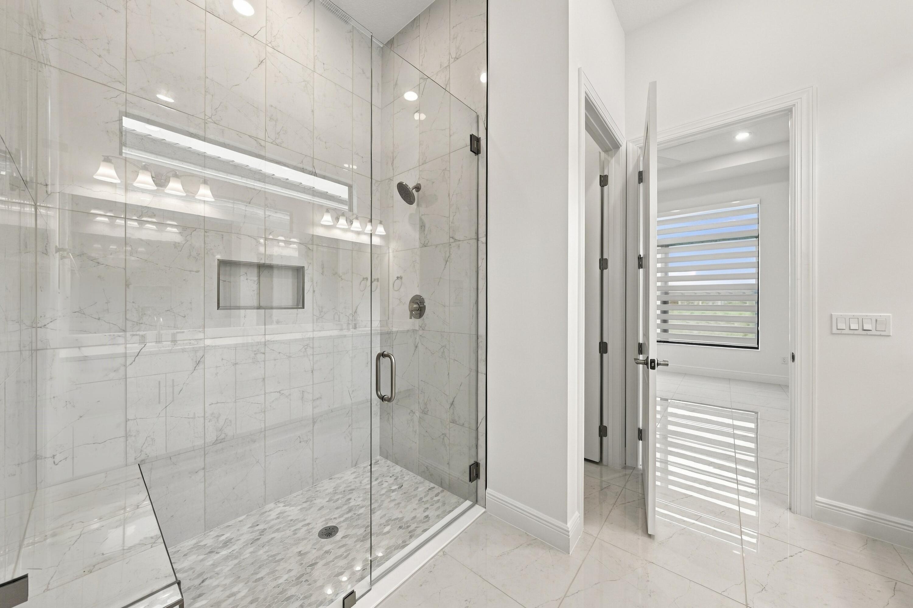 Primary bathroom with upgraded 96inch glass frameless shower satin nickel finishes