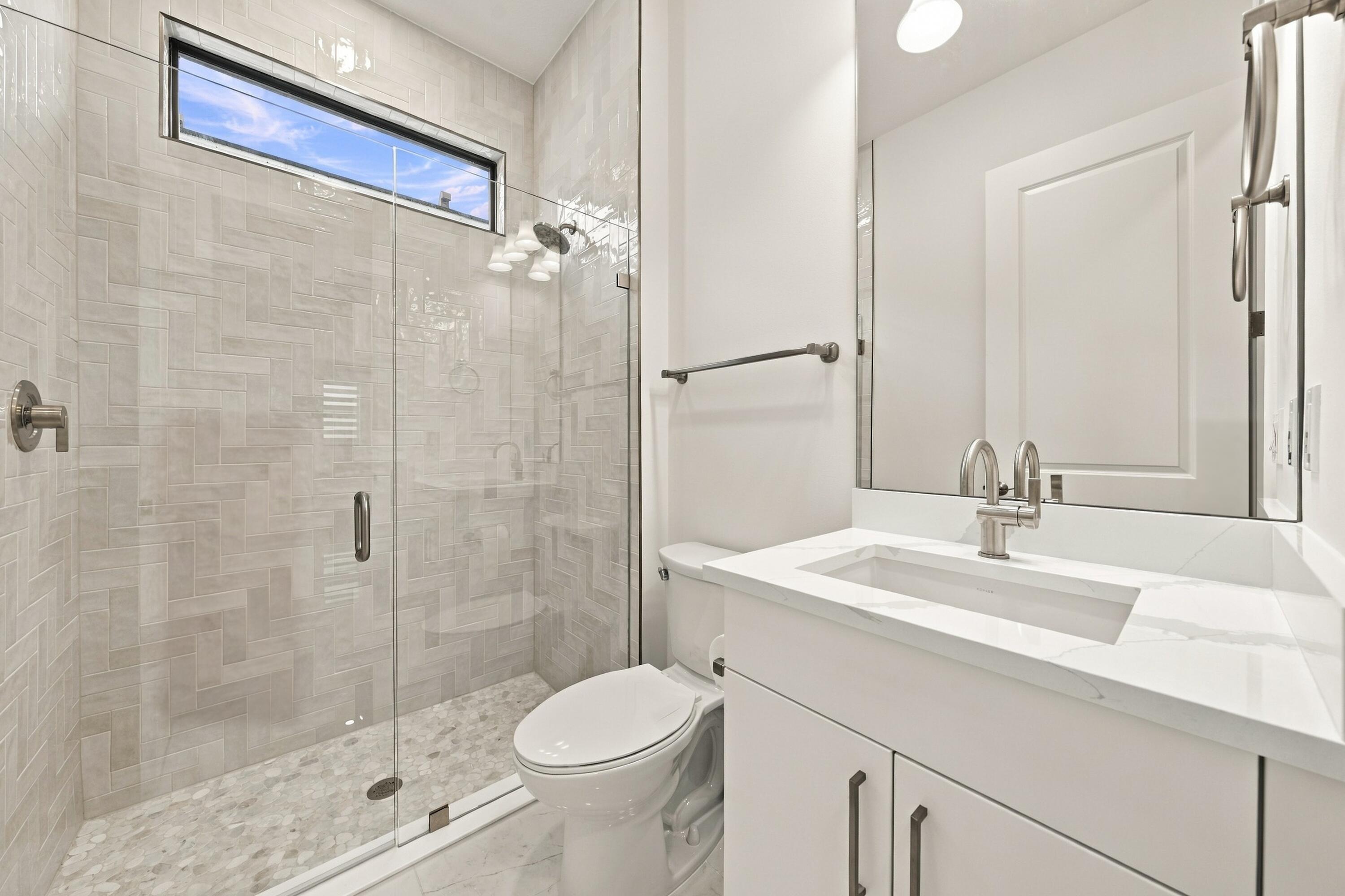 3rd bathroom, upgraded quartz countertop, upgraded glass frameless shower with tile and mirror to the ceiling