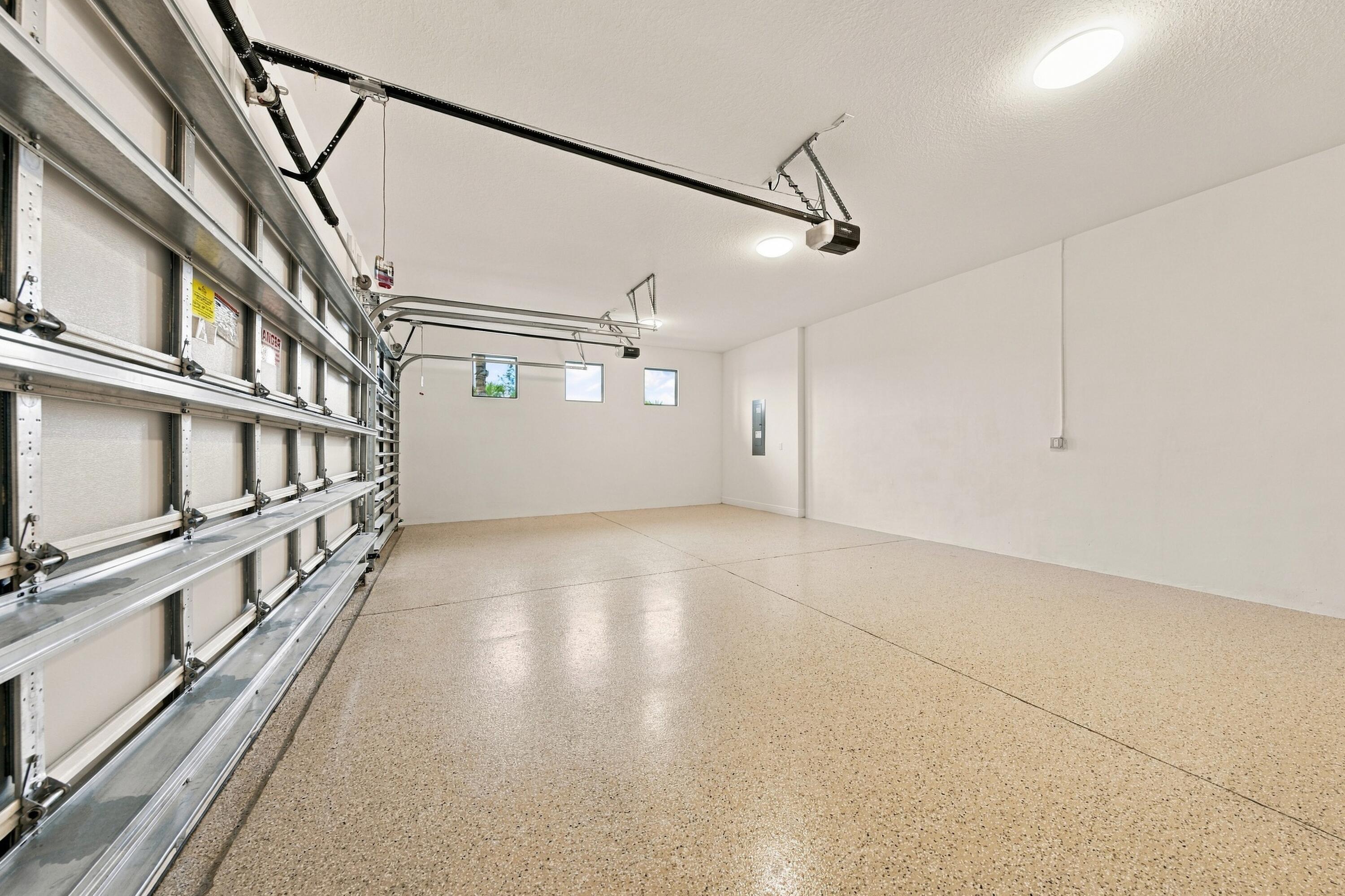 3 car garage with epoxy floors 3 windows and garage entry keypad
