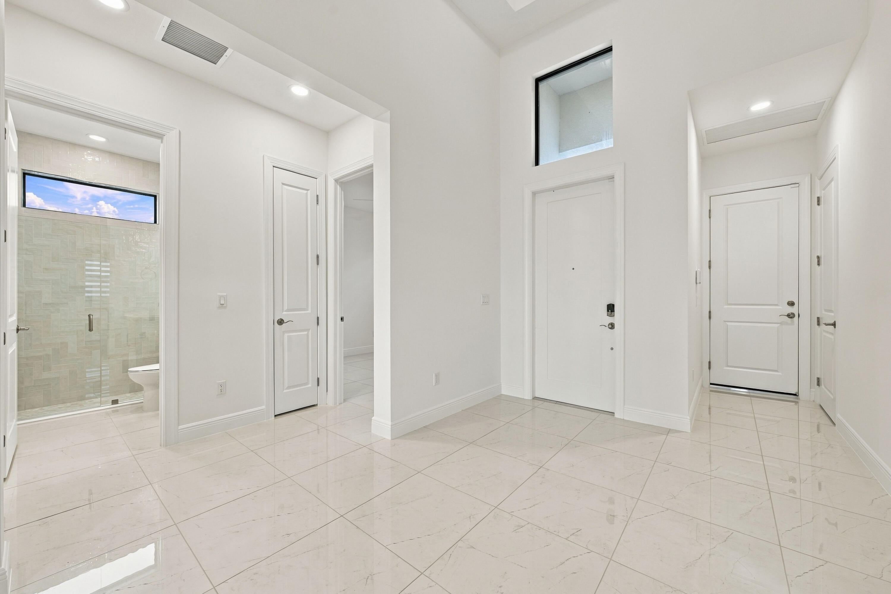 Entry, garage entry, 3rd bedroom and 3rd bathroom
