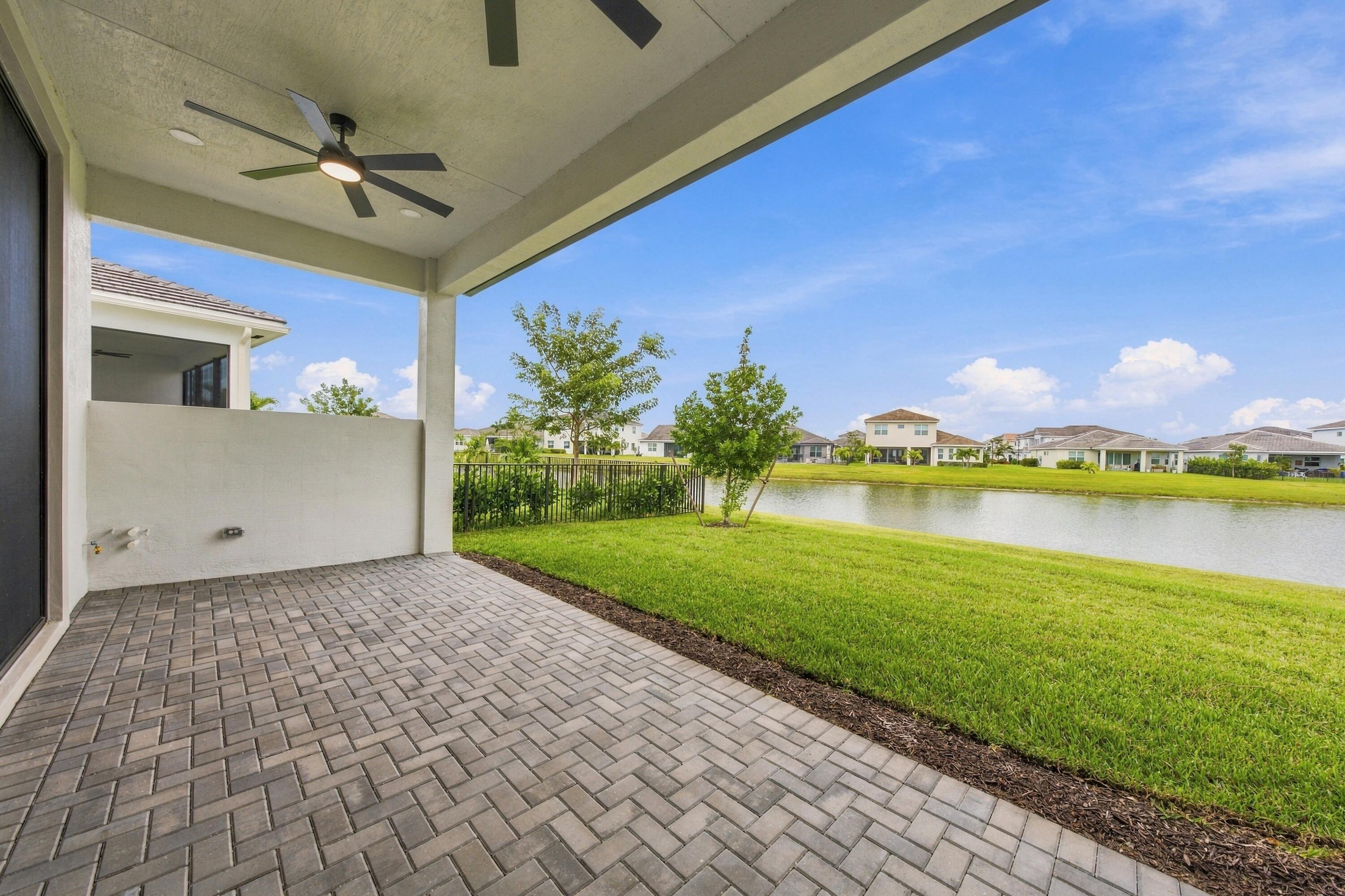 Lakefront covered lanai with ceiling fans, 5ft privacy wall and stub out gas/water lines for future summer kitchen