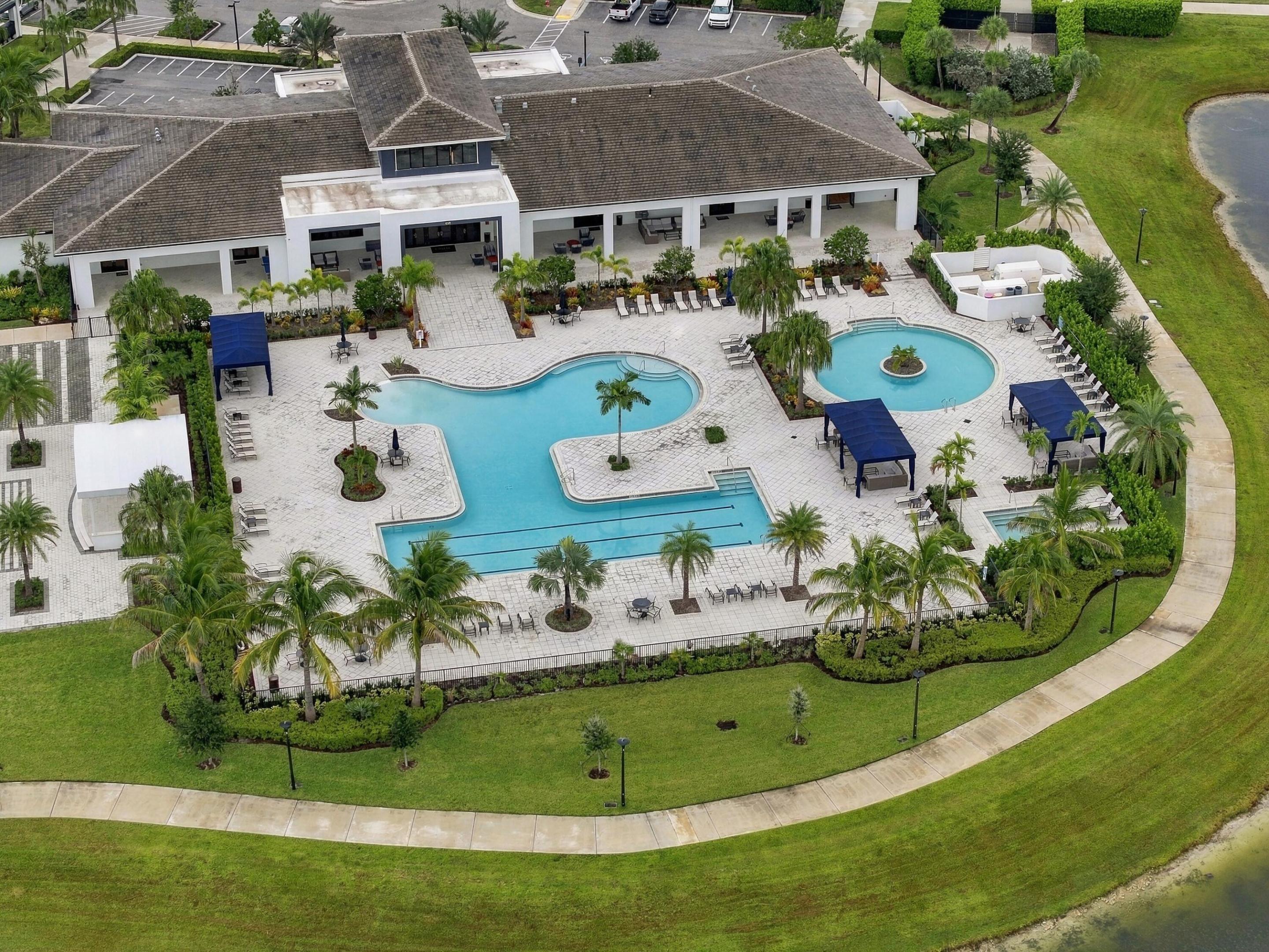 Cresswind clubhouse zero entry resort style pool with lap area, resistance pool, hot tub and cabanas