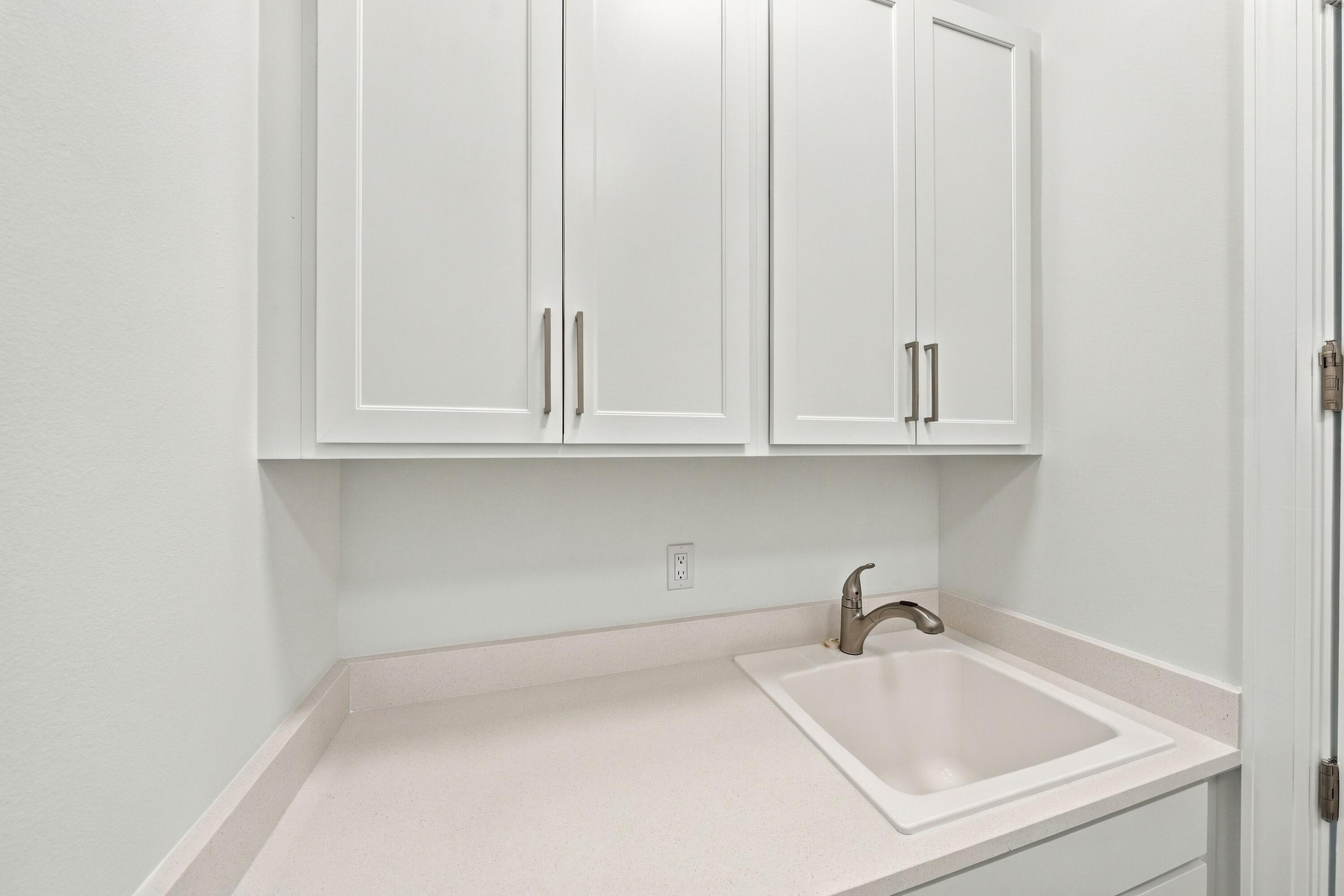 Laundry room upgraded countertop/sink with upper and lower cabinets