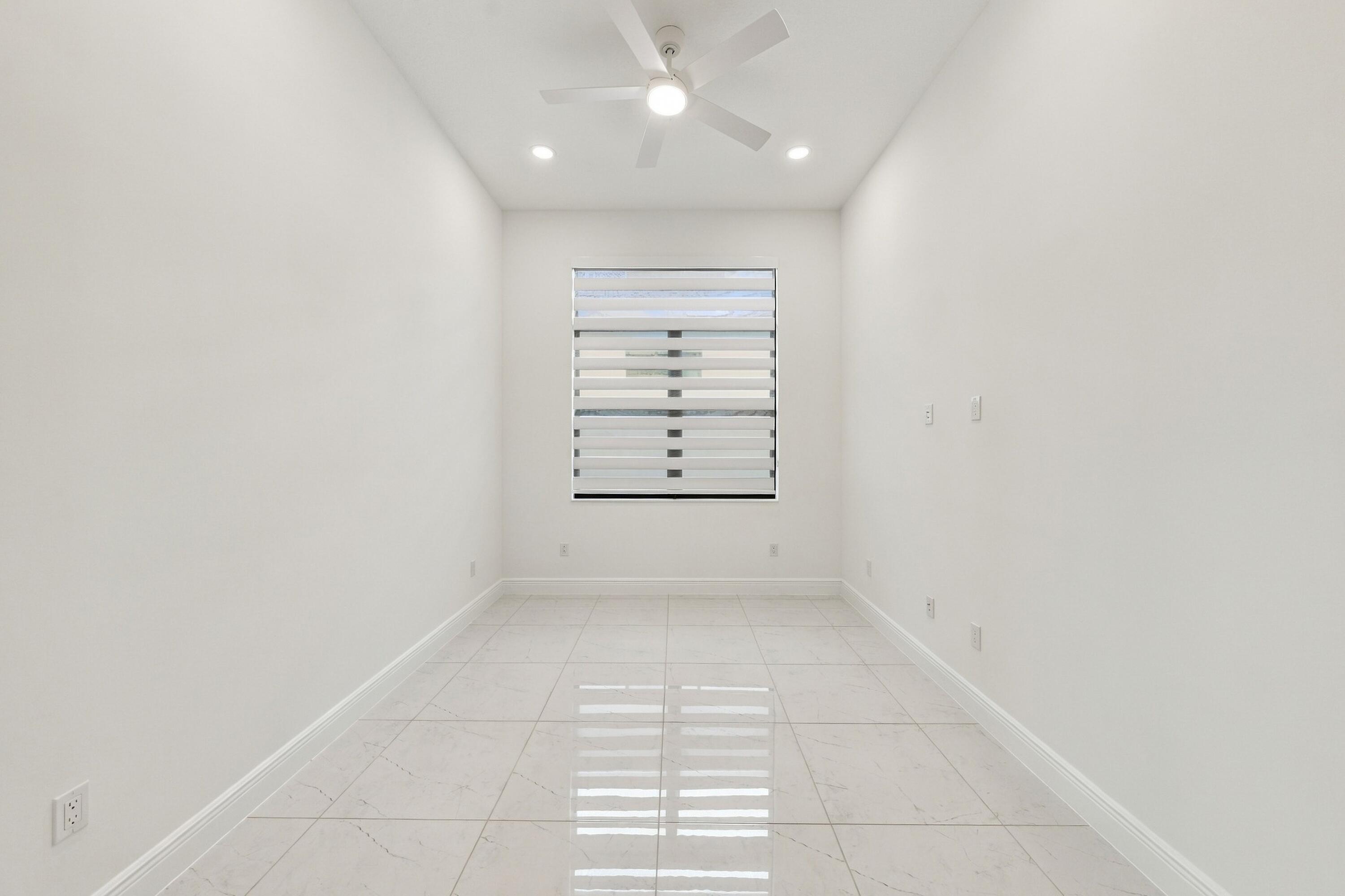 Flex room with raised tv outlet, ceiling fan and zebra blinds/Office/4th bedroom