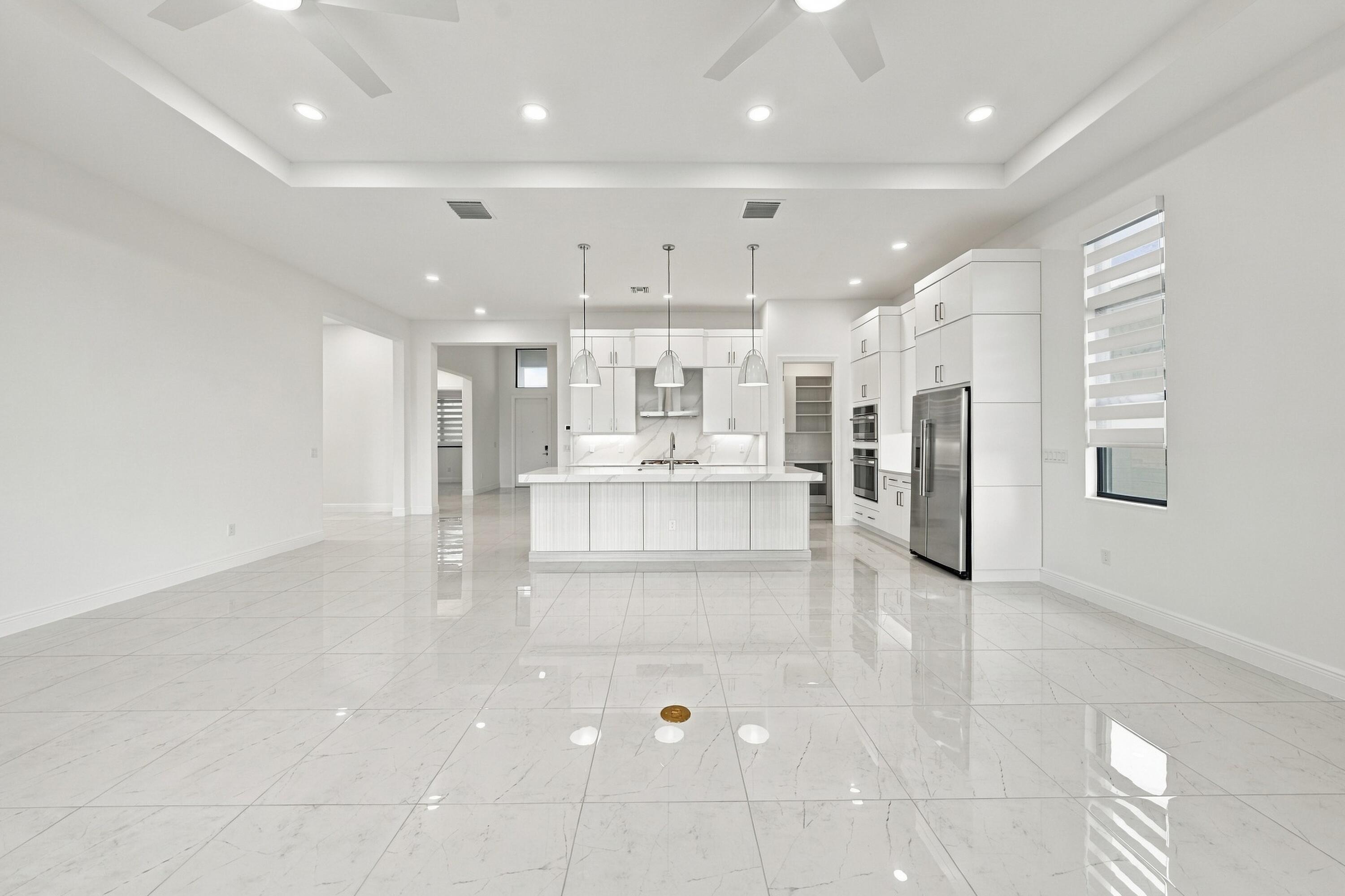 From sliding glass doors into great room, dining room and kitchen