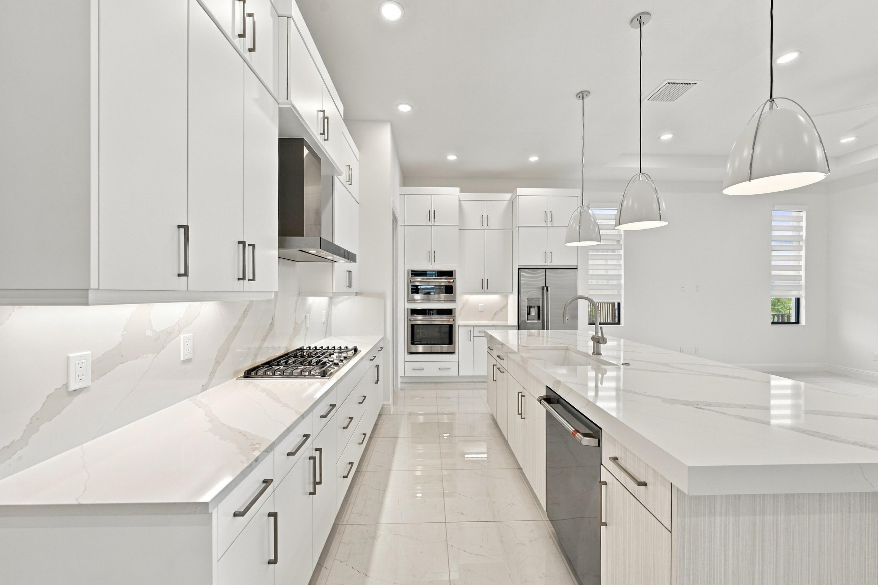 Satin nickel finishes with upgraded quartz countertops and backsplash