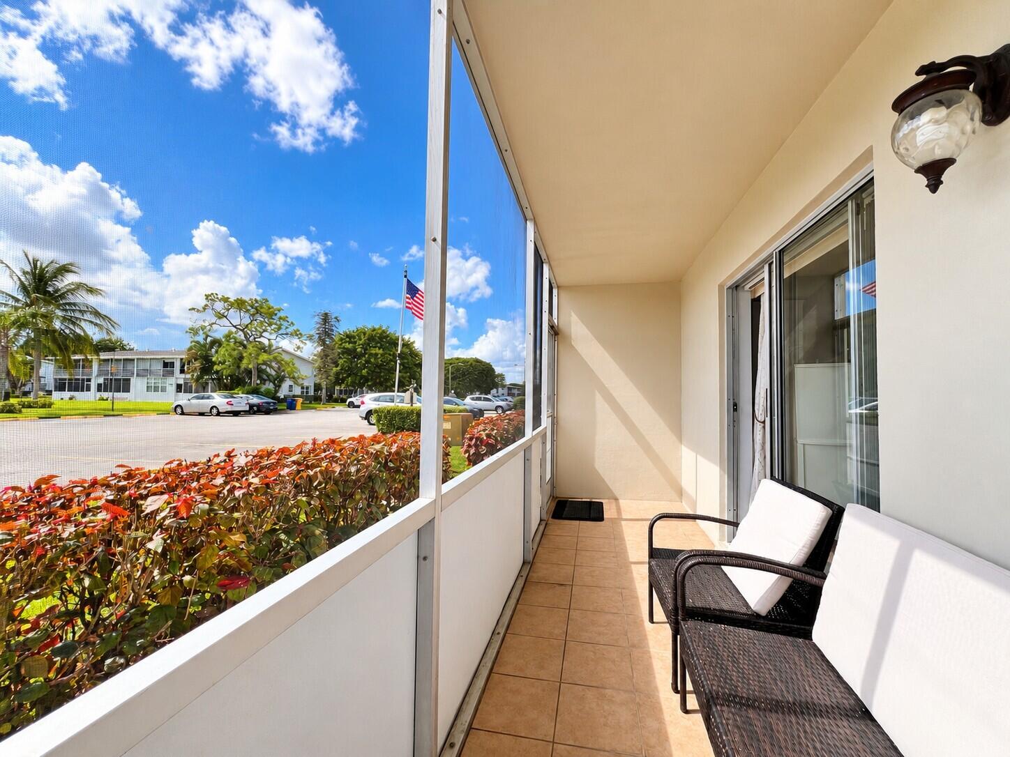 Long Screened Lanai With Door to Access Your Assigned Parking Spot! Long Screened Lanai With Door to Access Your Assigned Parking Spot!