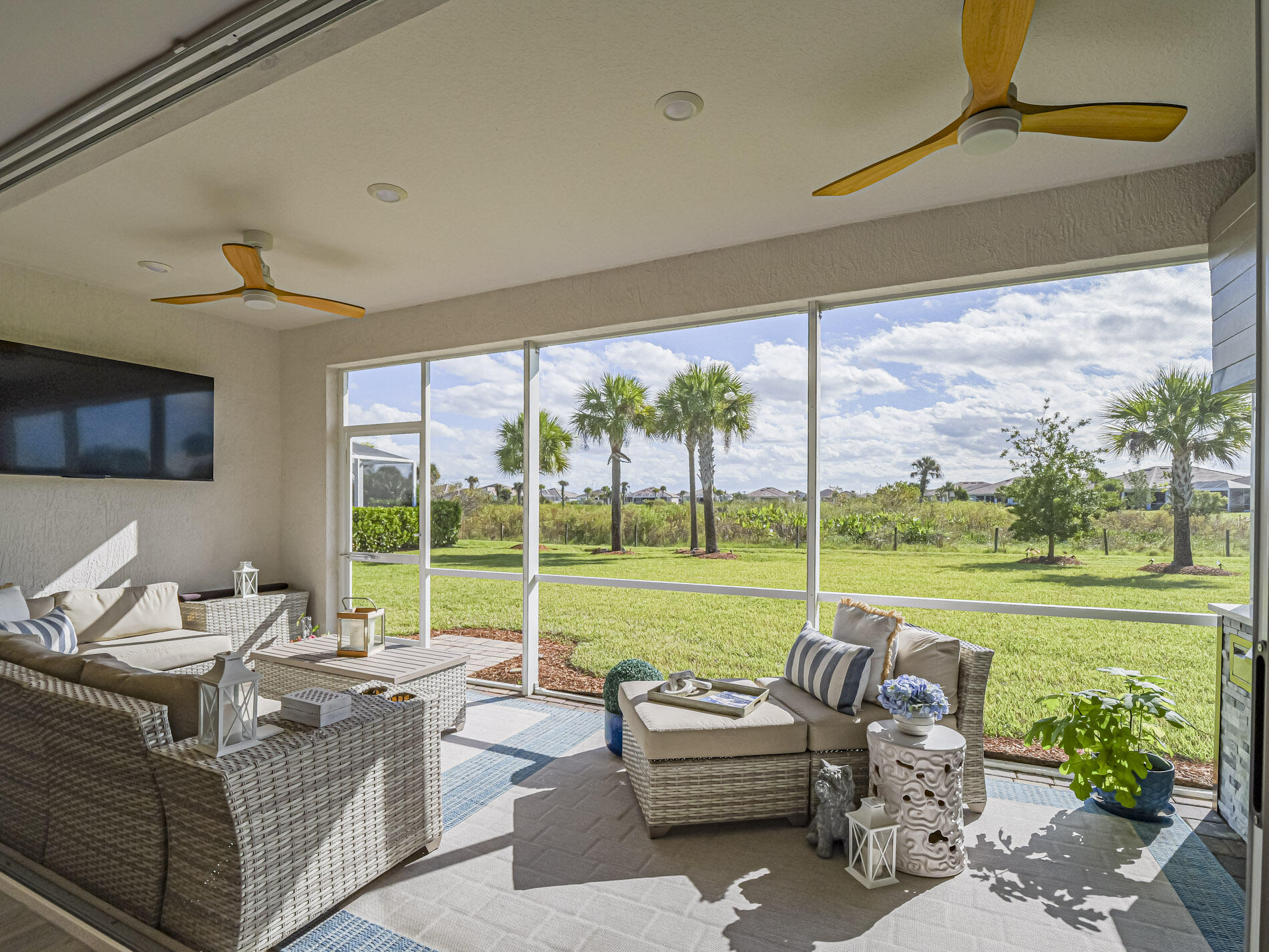 Screened lanai with custom ceiling fans