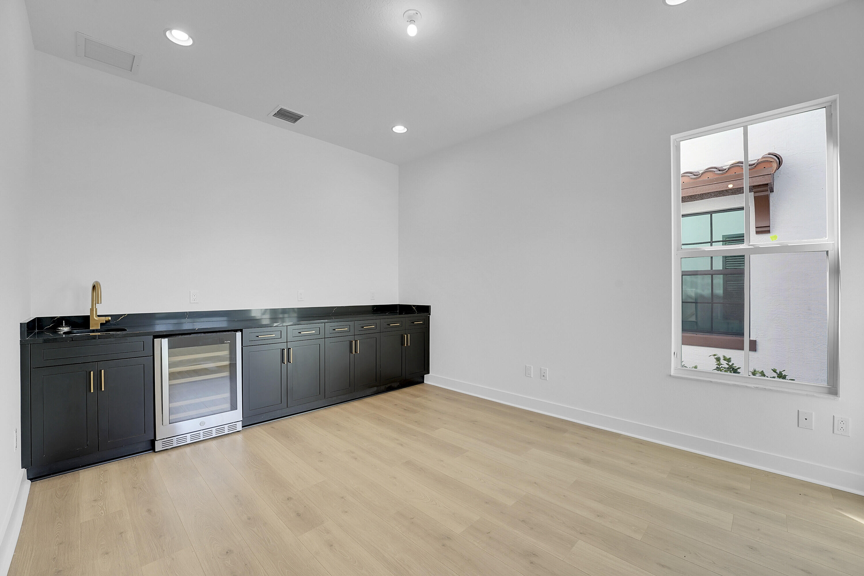Den w/ Wet Bar and beverage frig