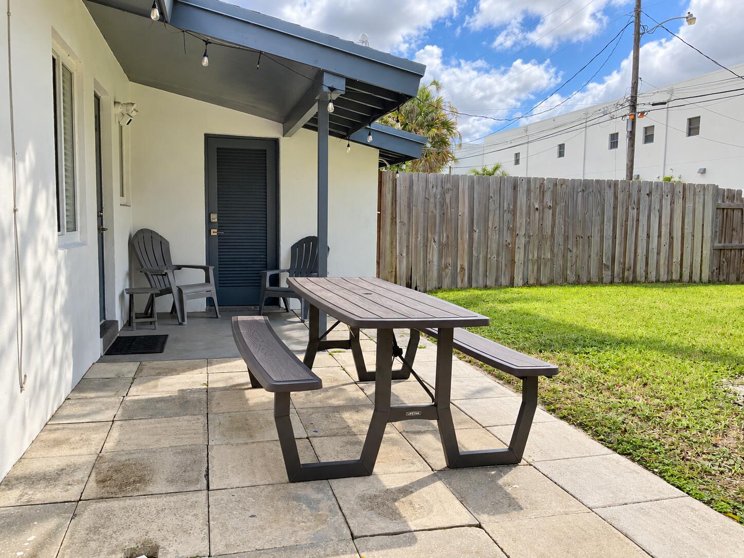 Sunny Backyard Patio with Picnic Table