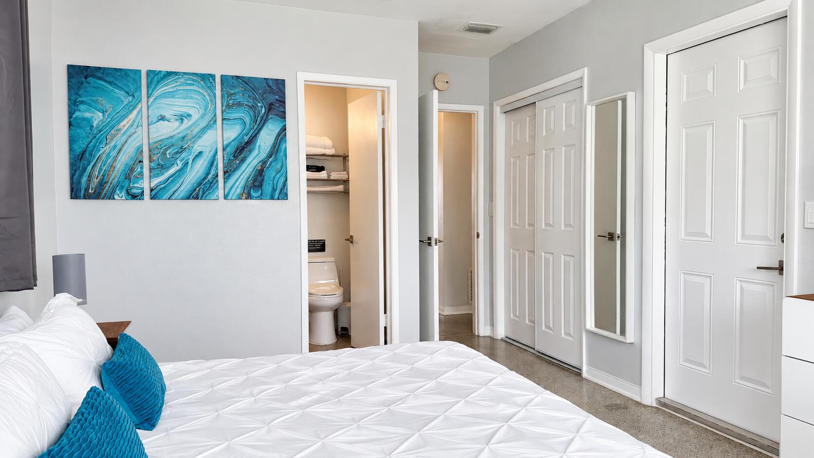 Modern Coastal Bedroom with Teal Accents