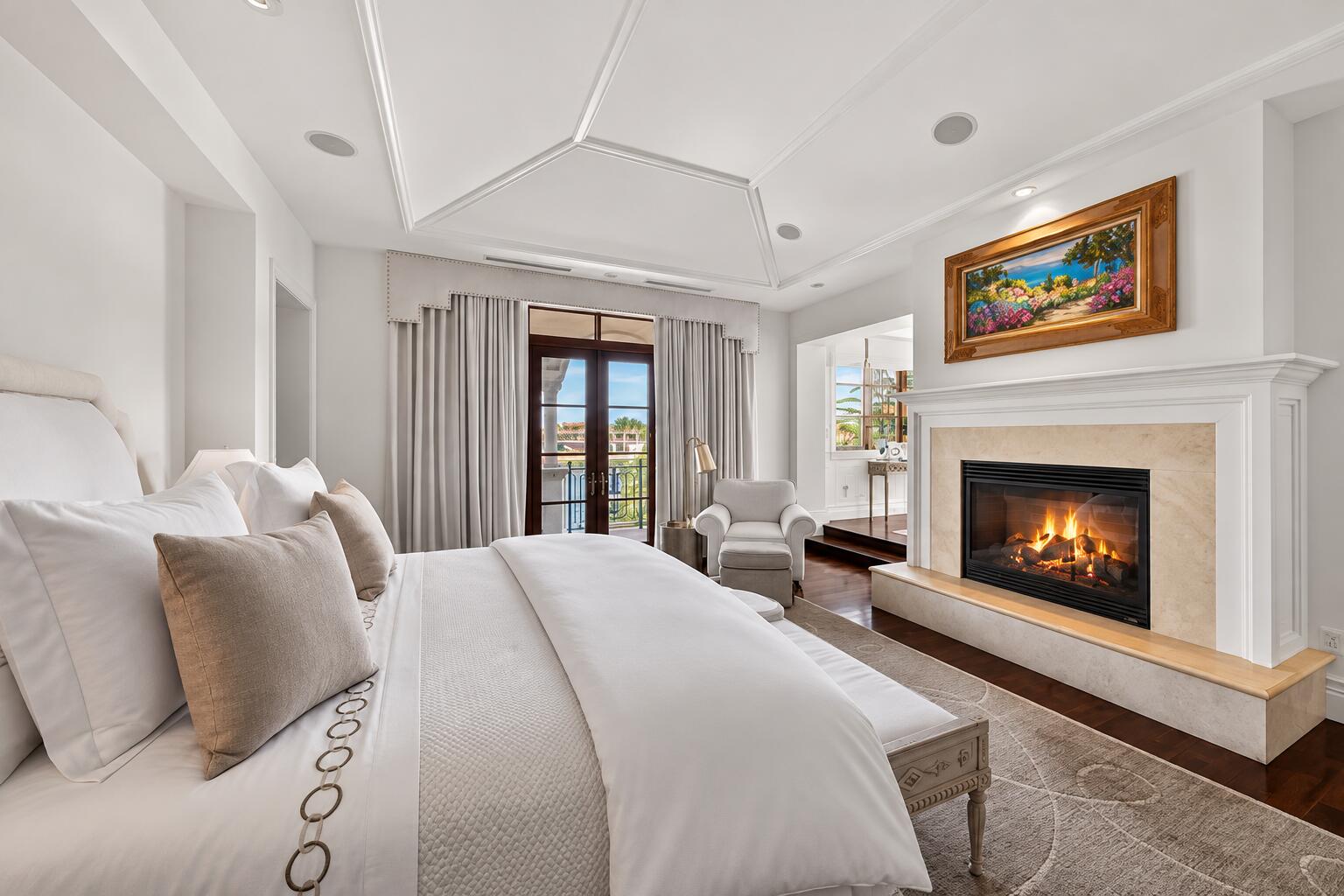 Crisp Luxury Bedroom with Cozy Fireplace