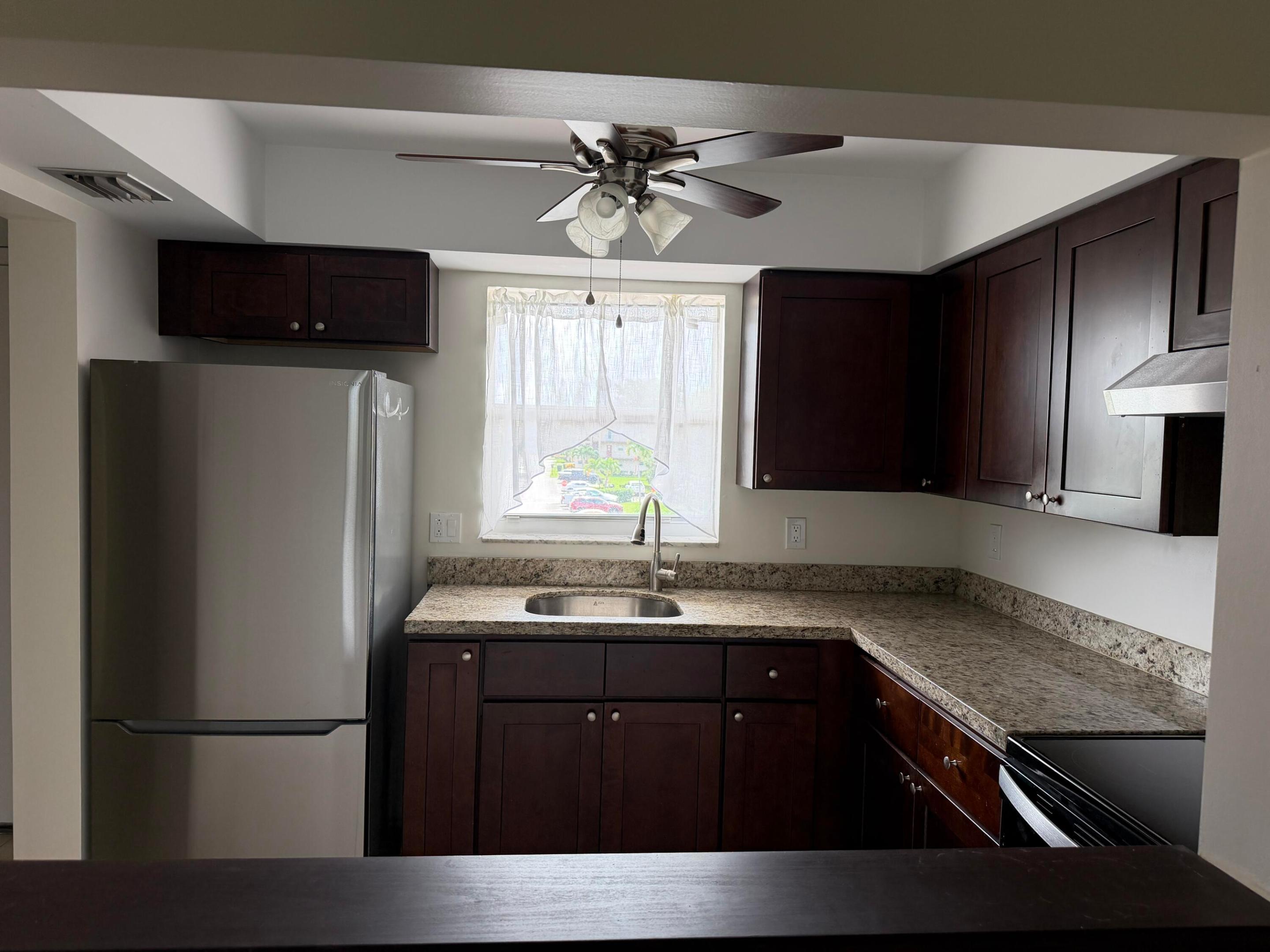 Kitchen w newer refrigerator