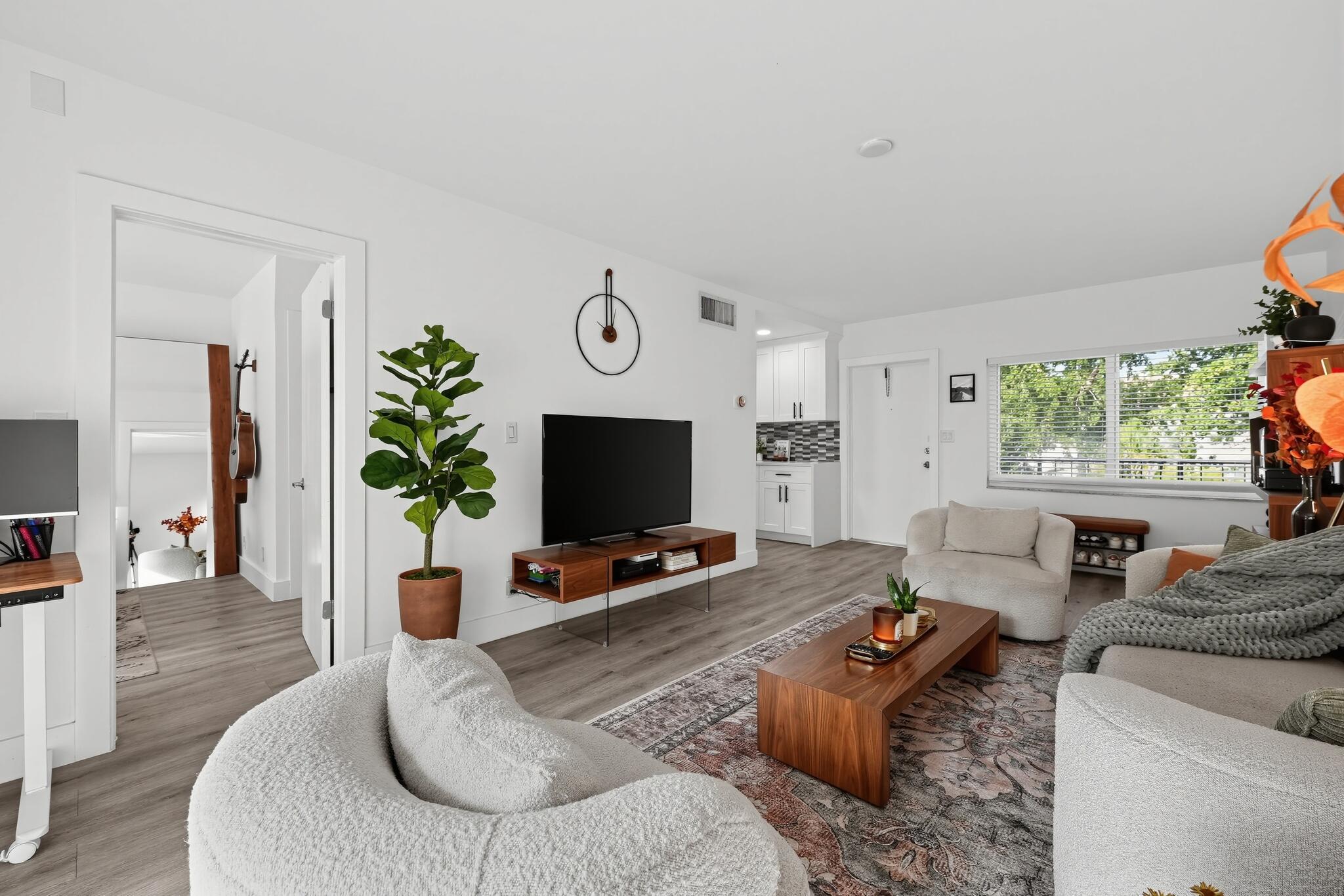 Chic interior features luxury vinyl flooring.
