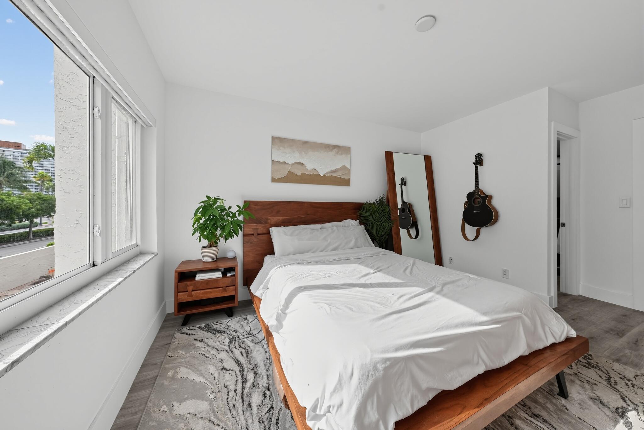 Bedroom with electric shades