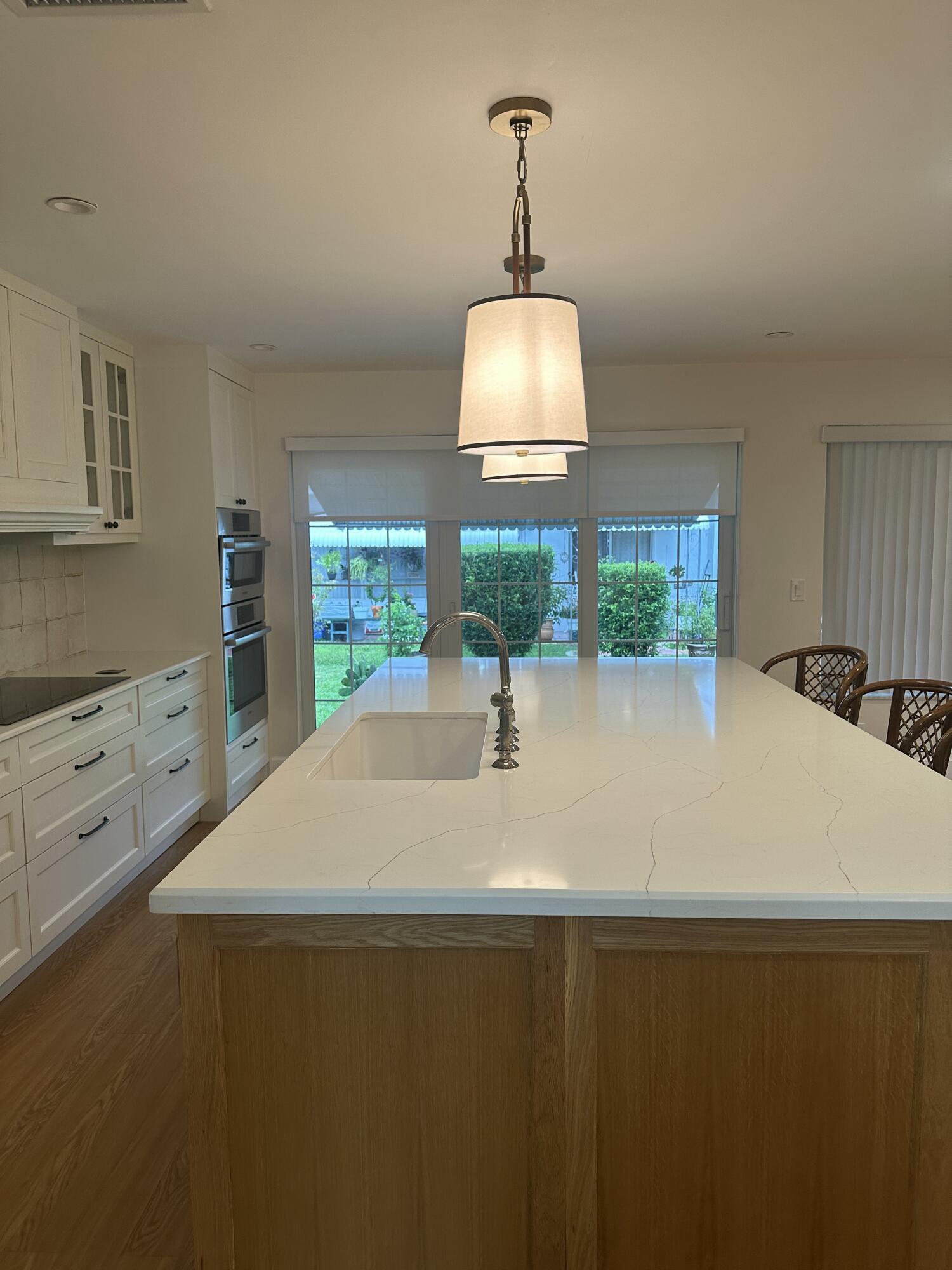Kitchen Island with Dishwasher & Wine Cooler & Sliding Doors Out To Patio