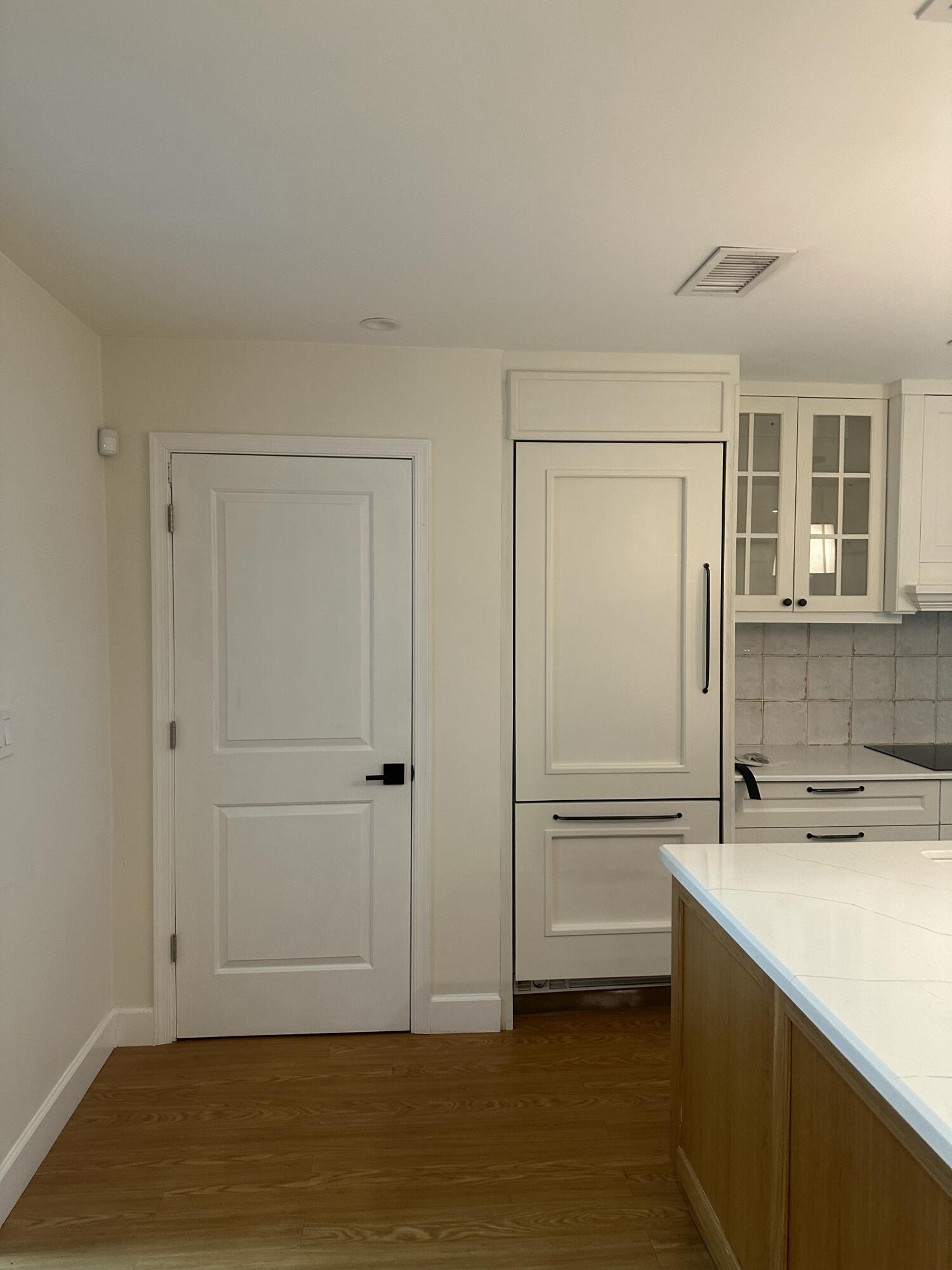 Door to Attached Garage and Laundry