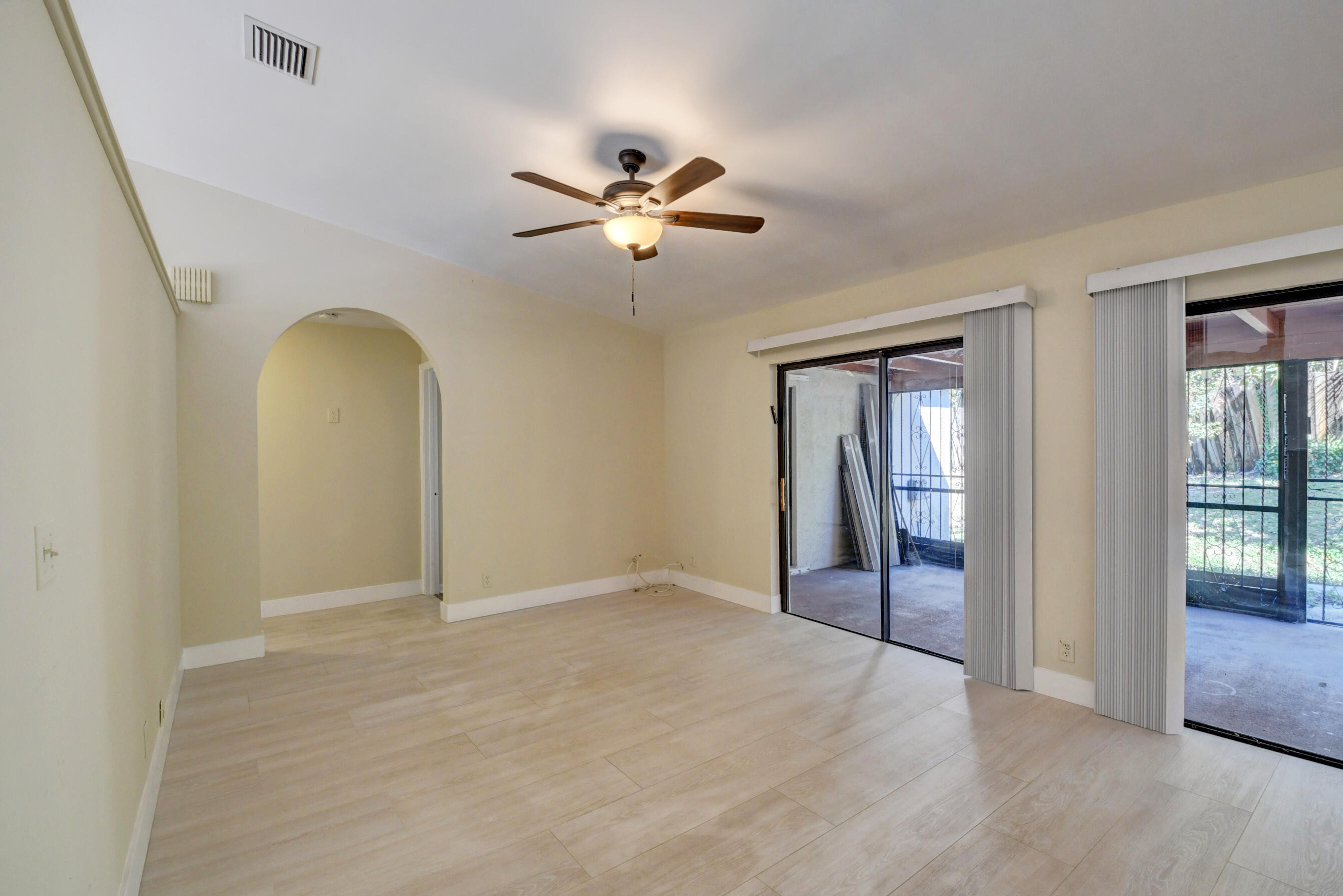 Spacious Living Area with Sliding Glass Doors & Abundant Natural Light