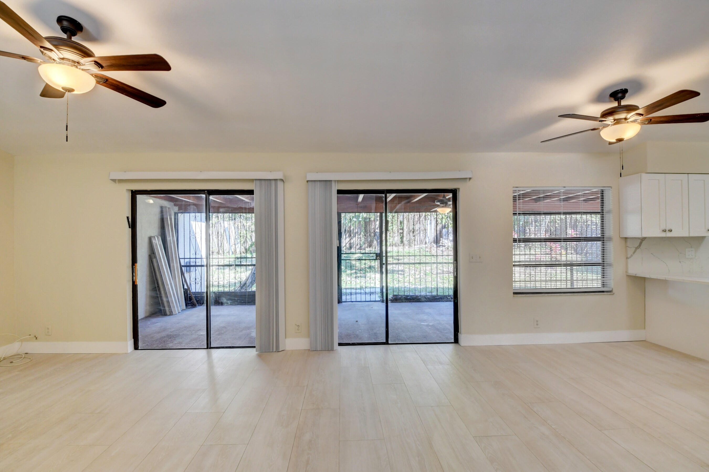 Spacious Living Area with Sliding Glass Doors & Abundant Natural Light