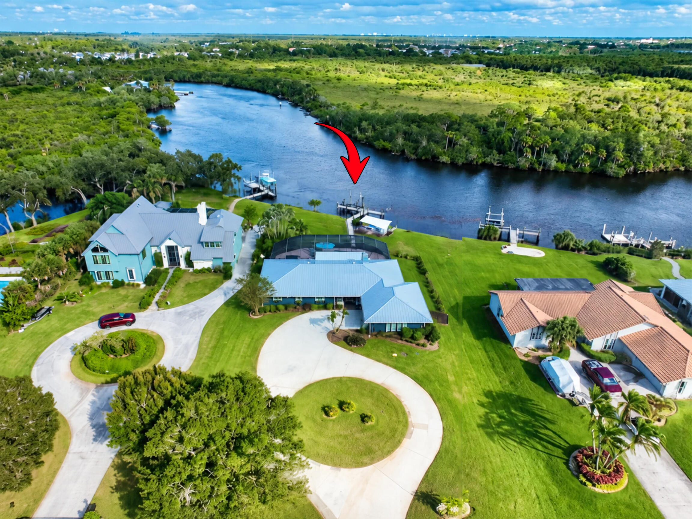 Over 0.6 acres, oversized circular drive...amazing river views from every angle!