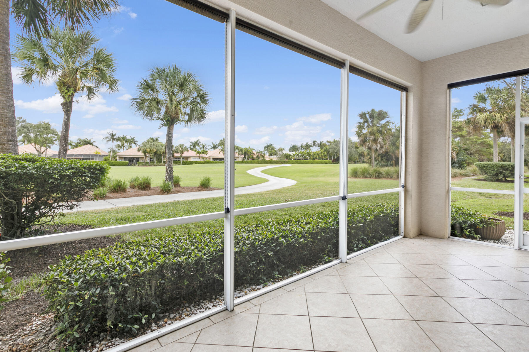 Screened patio with golf-front views