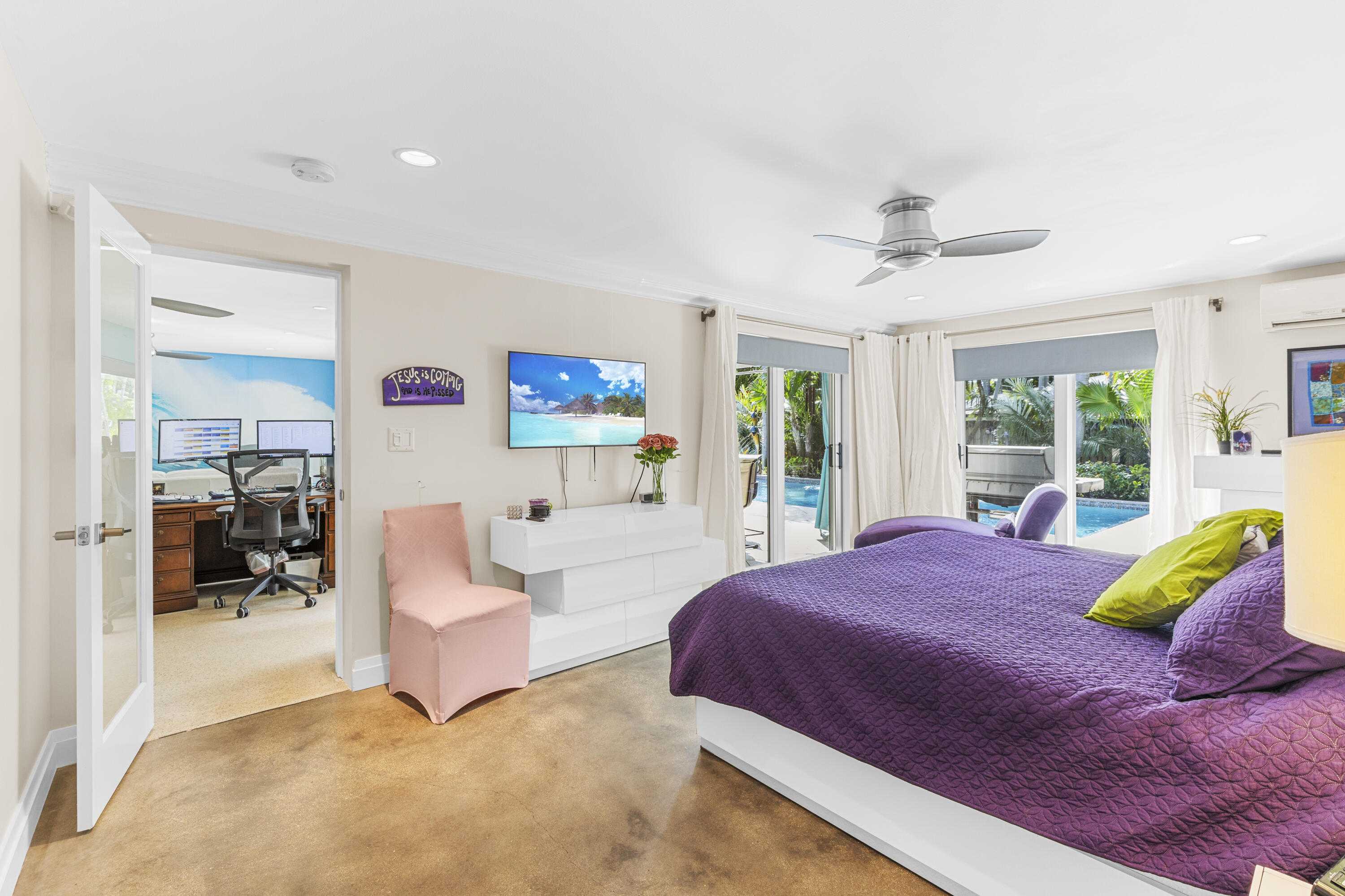 Polished concrete flooring, ceiling fan with integrated lighting, recessed lighting, and sliding glass doors with exterior pool access