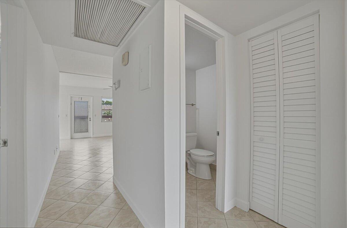 Hallway facing 1/2 bath