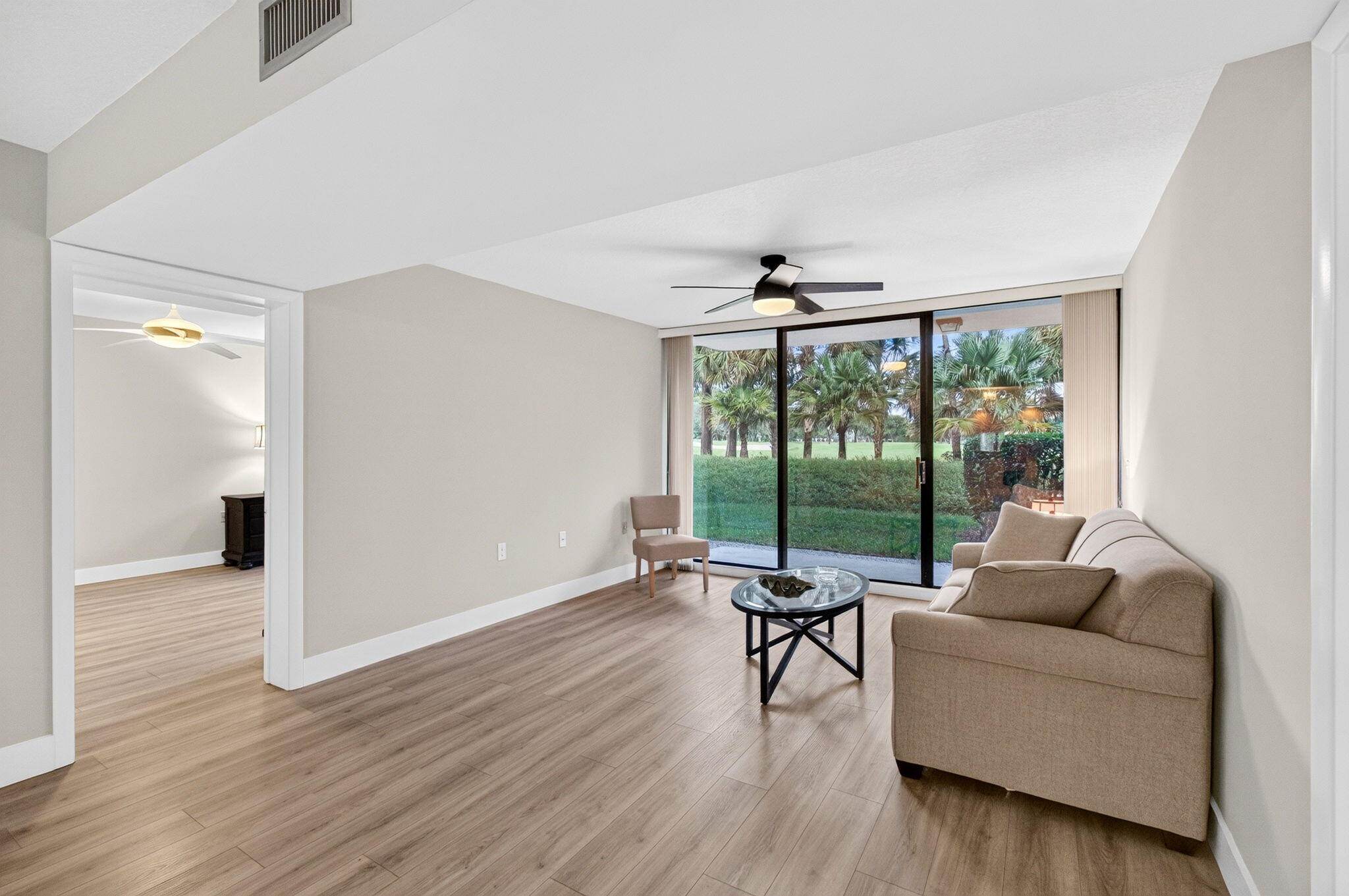 Walk out Patio with golf course view. Freshly painted with new laminate floors
