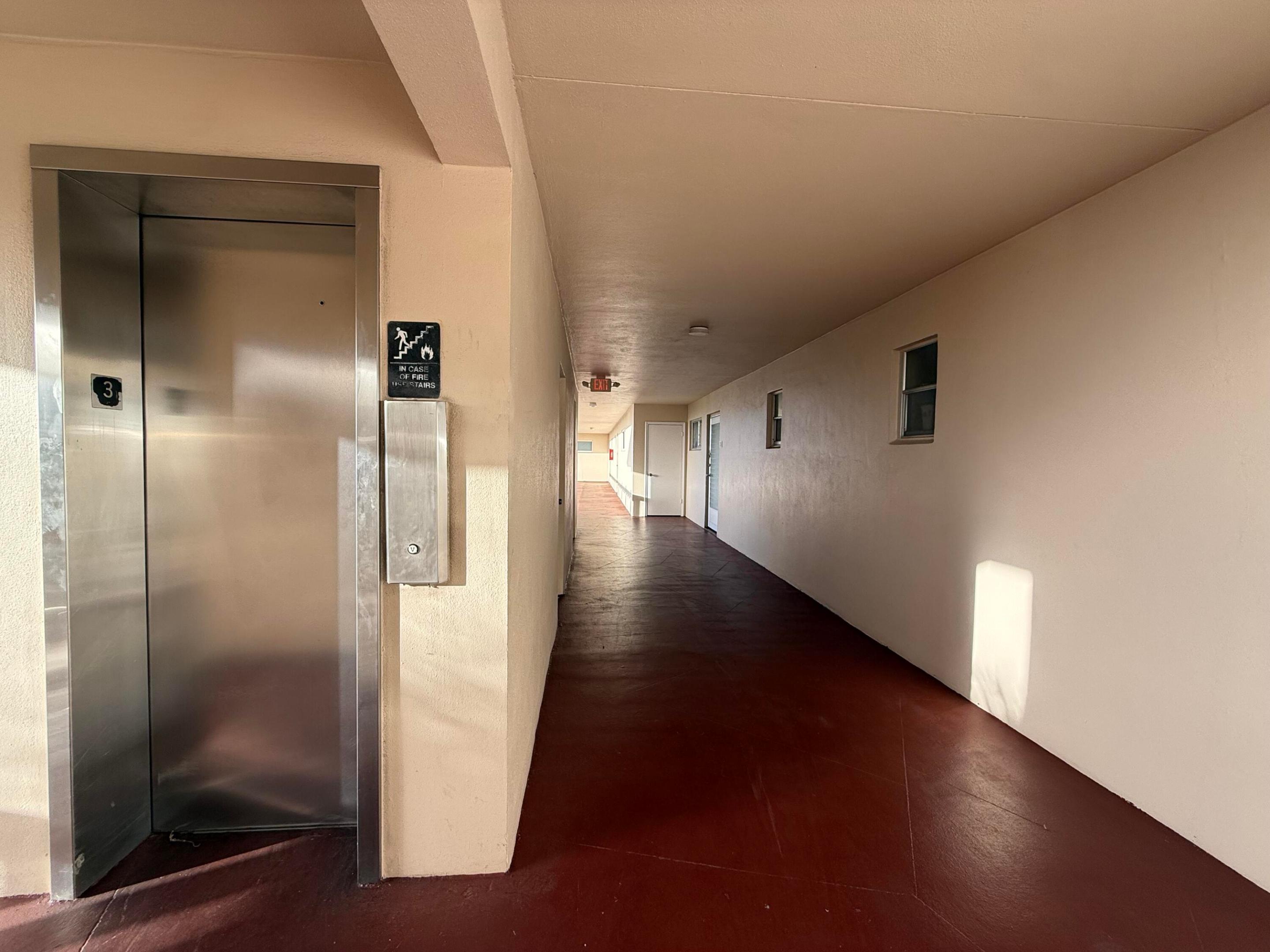 Next to elevator and stairs