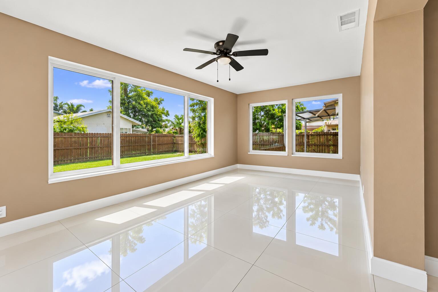 Sunlit Empty Room with Glossy Floors Sunlit Empty Room with Glossy Floors