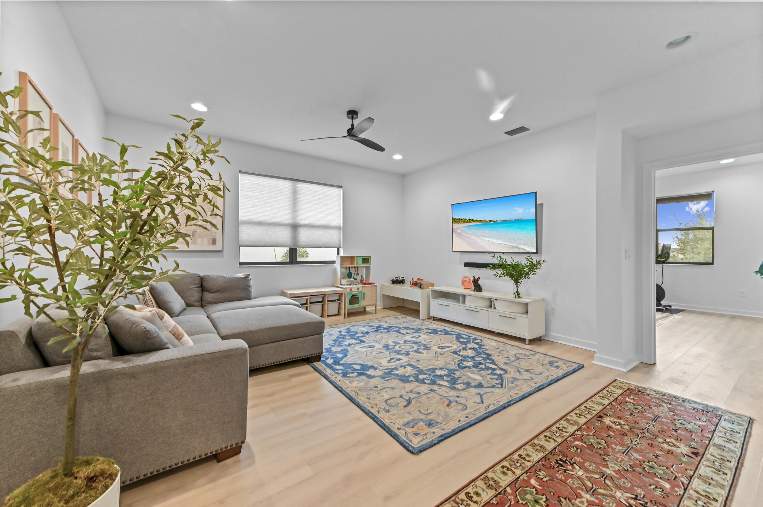 Spacious second floor family room with recessed lighting, high ceilings could potentially serve as 4th bedroom