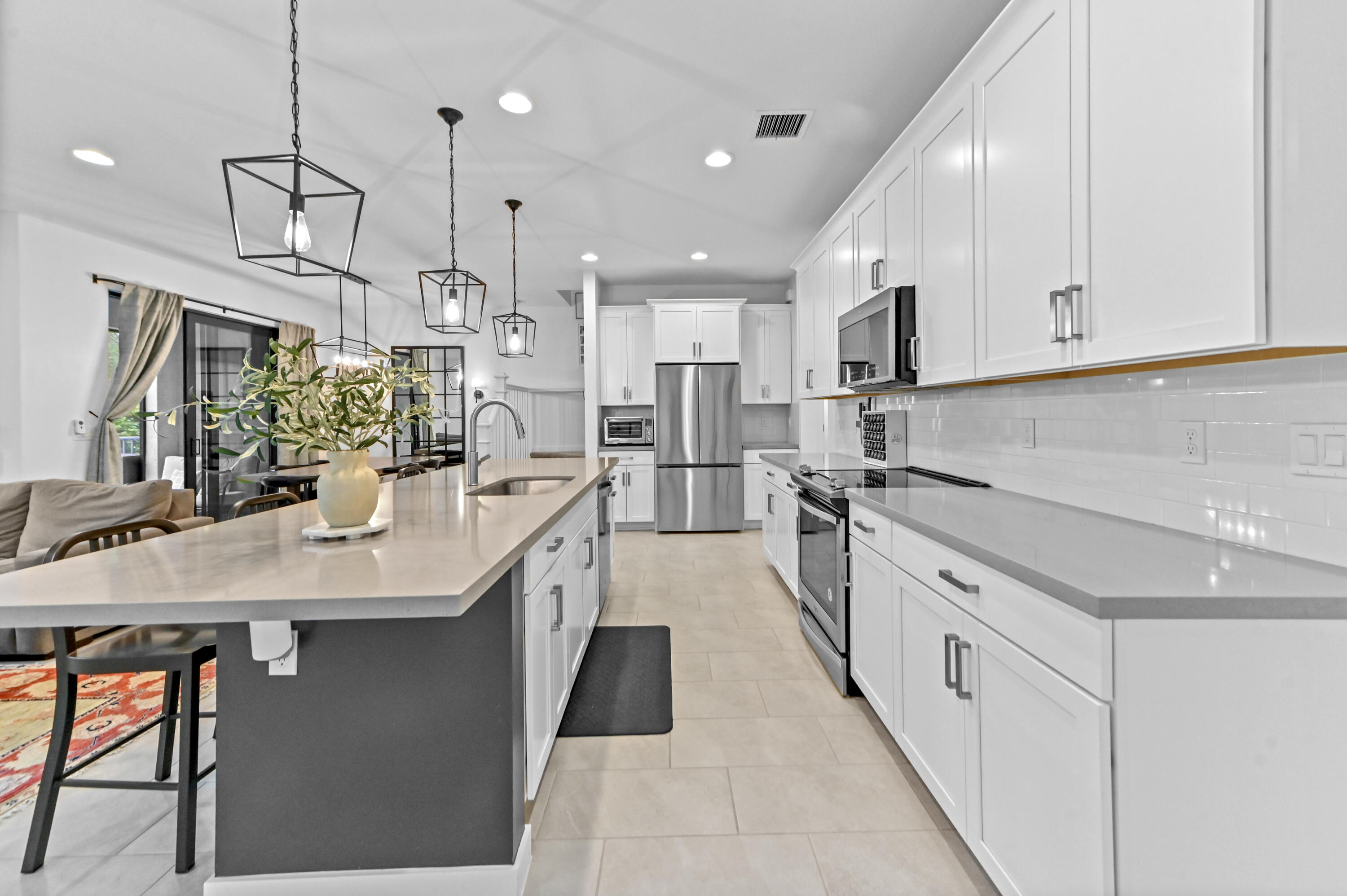 Gourmet kitchen with stainless steel appliances and quartz counters