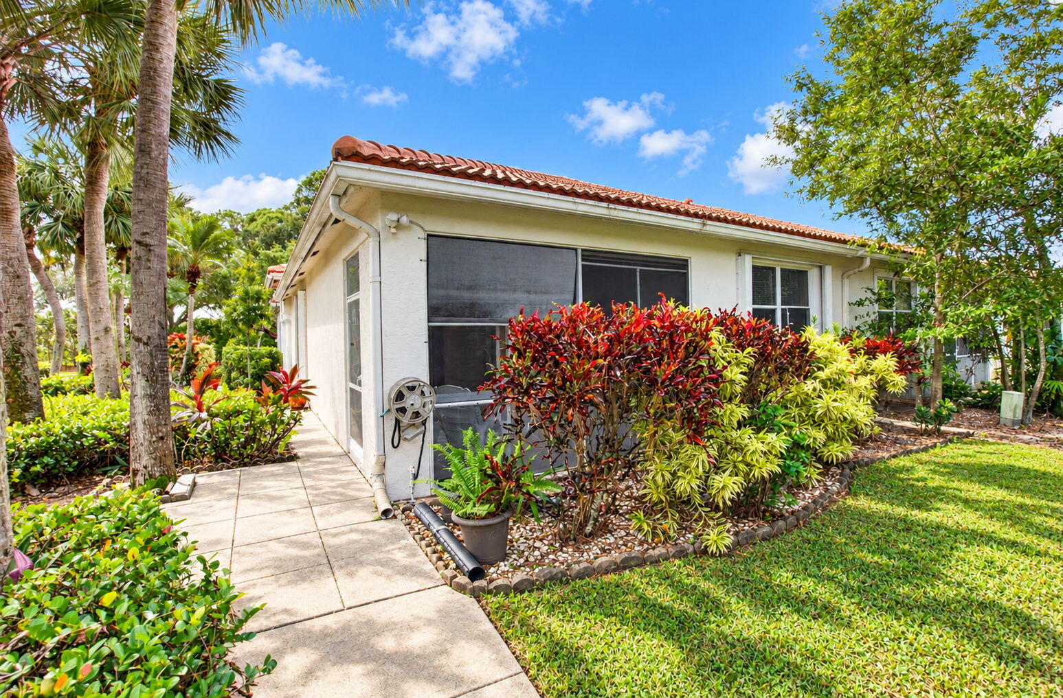 Peaceful Screened Lanai Overlooking Lush Tropical Landscaping Peaceful Screened Lanai Overlooking Lush Tropical Landscaping