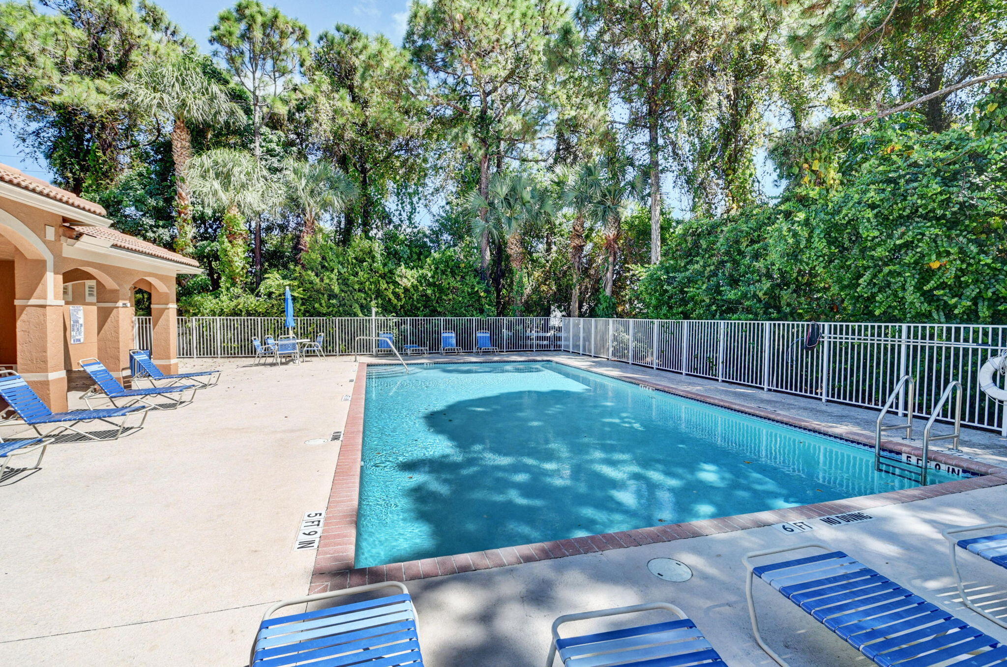 Inviting Pool & Sundeck in a Serene Garden Setting