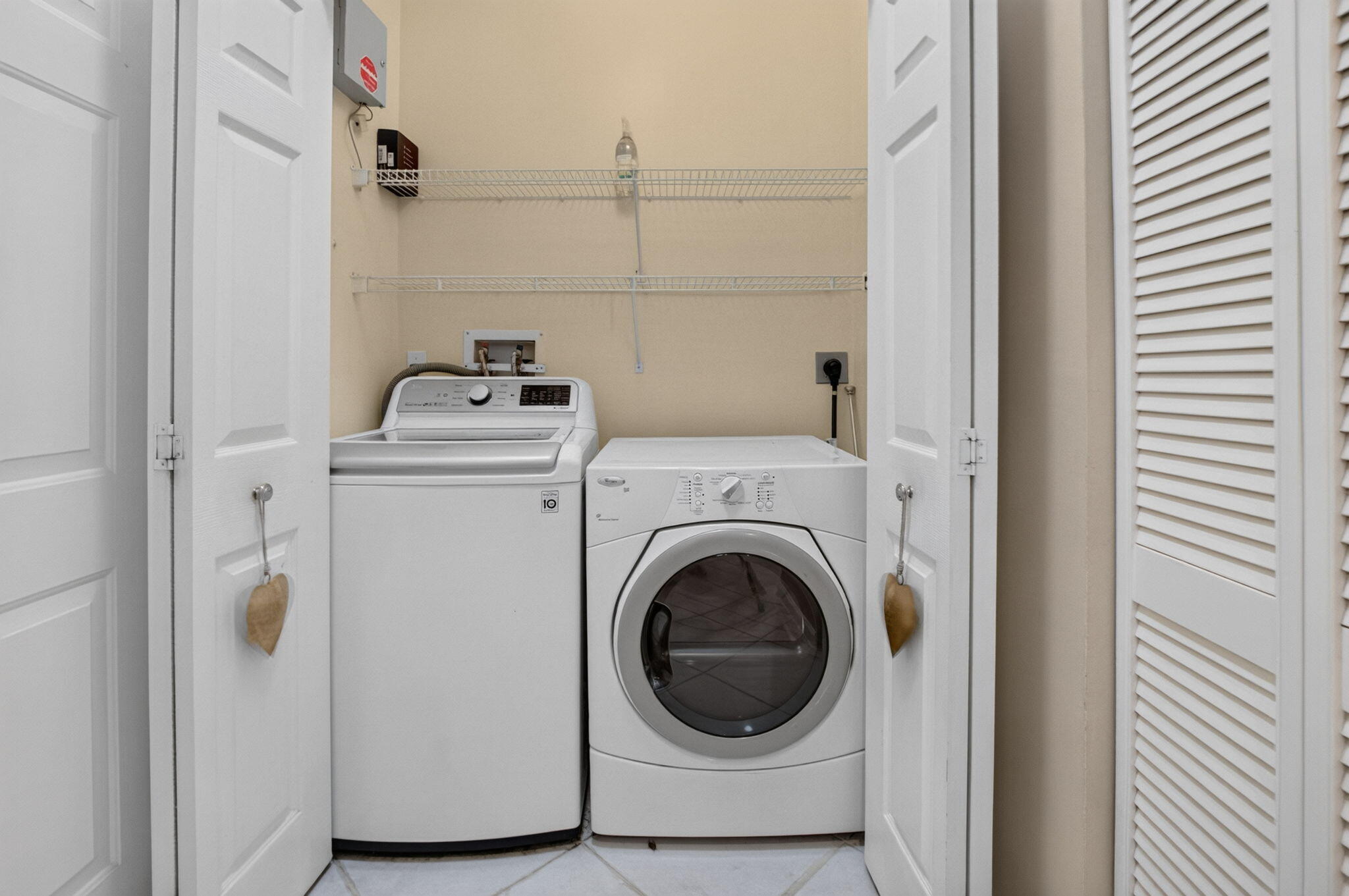 Dedicated Laundry Area with Built-In Shelving