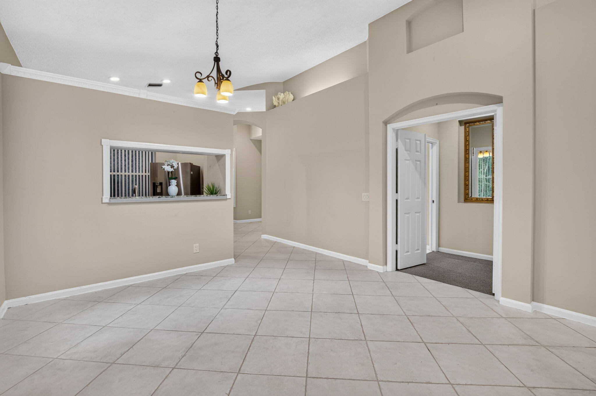 Soaring Ceilings & Double Doors Leading to the Primary Retreat