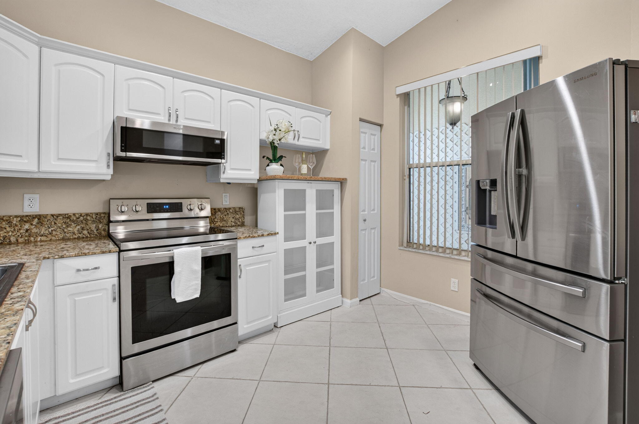 Spacious Kitchen with Stainless Steel French-Door Refrigerator