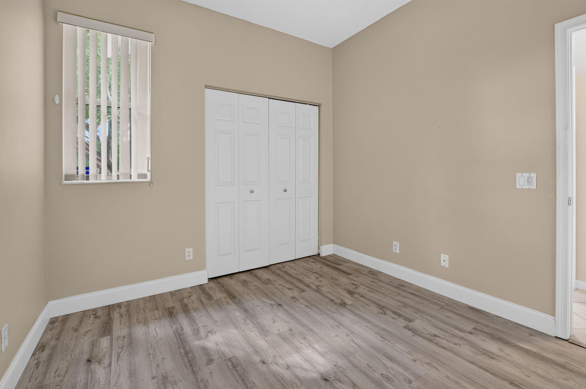 Spacious Second Bedroom with Double-Door Closet