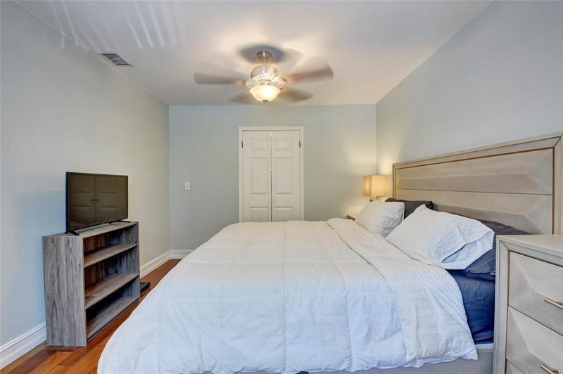 Large bedroom upstairs with built-in walking closet