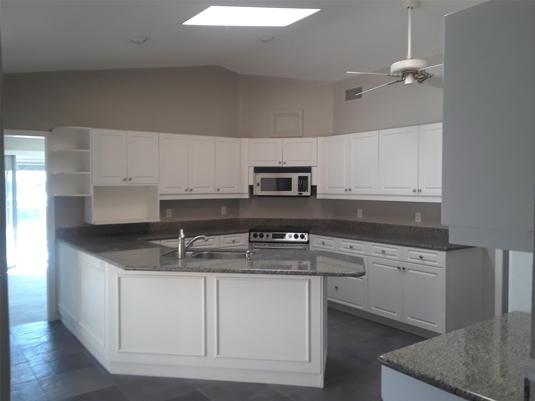 Remodeled kitchen with high ceiling and skylight Remodeled kitchen with high ceiling and skylight