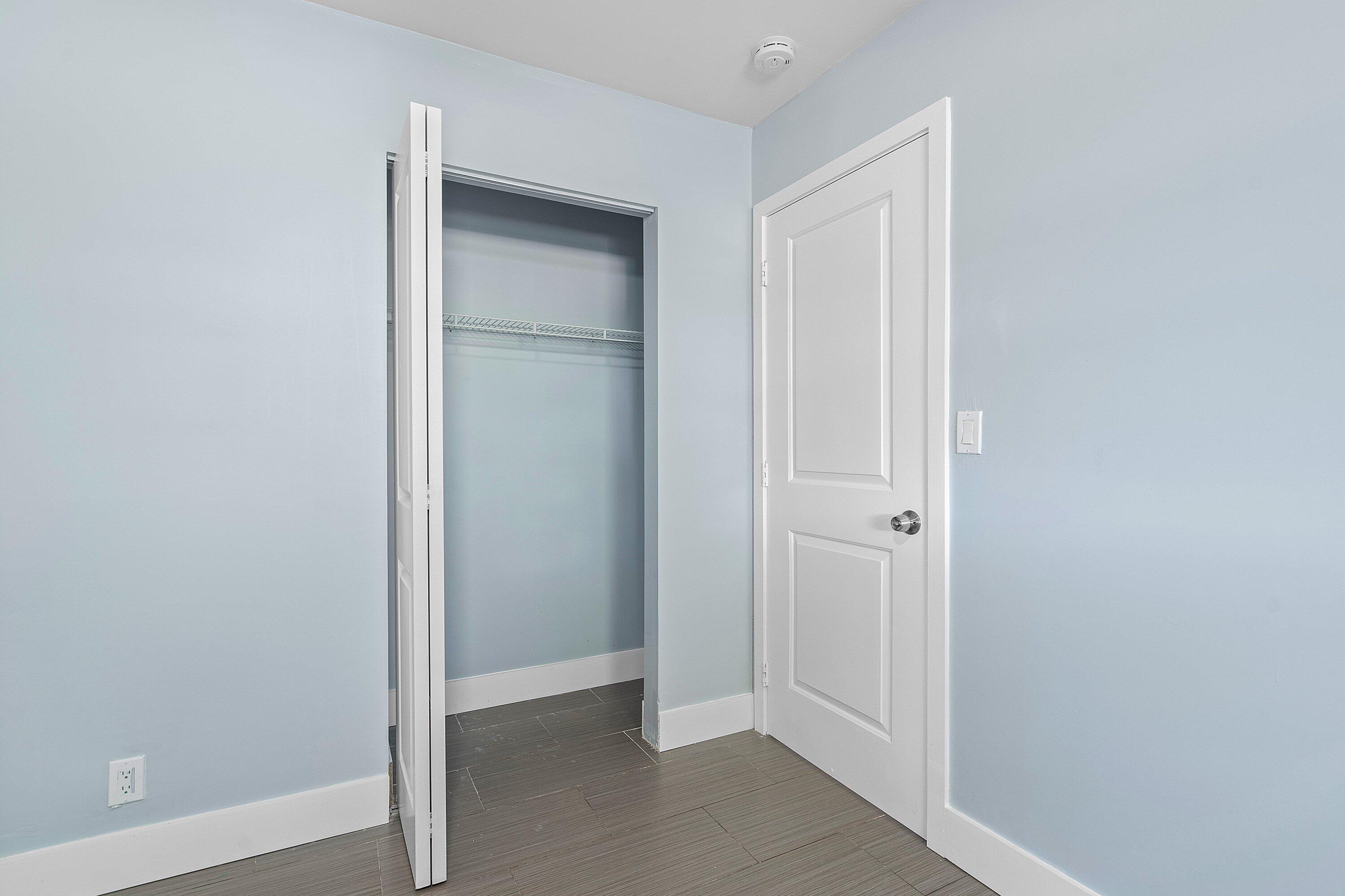 Tile flooring, solid-core interior doors, bifold closet door, and integrated shelving