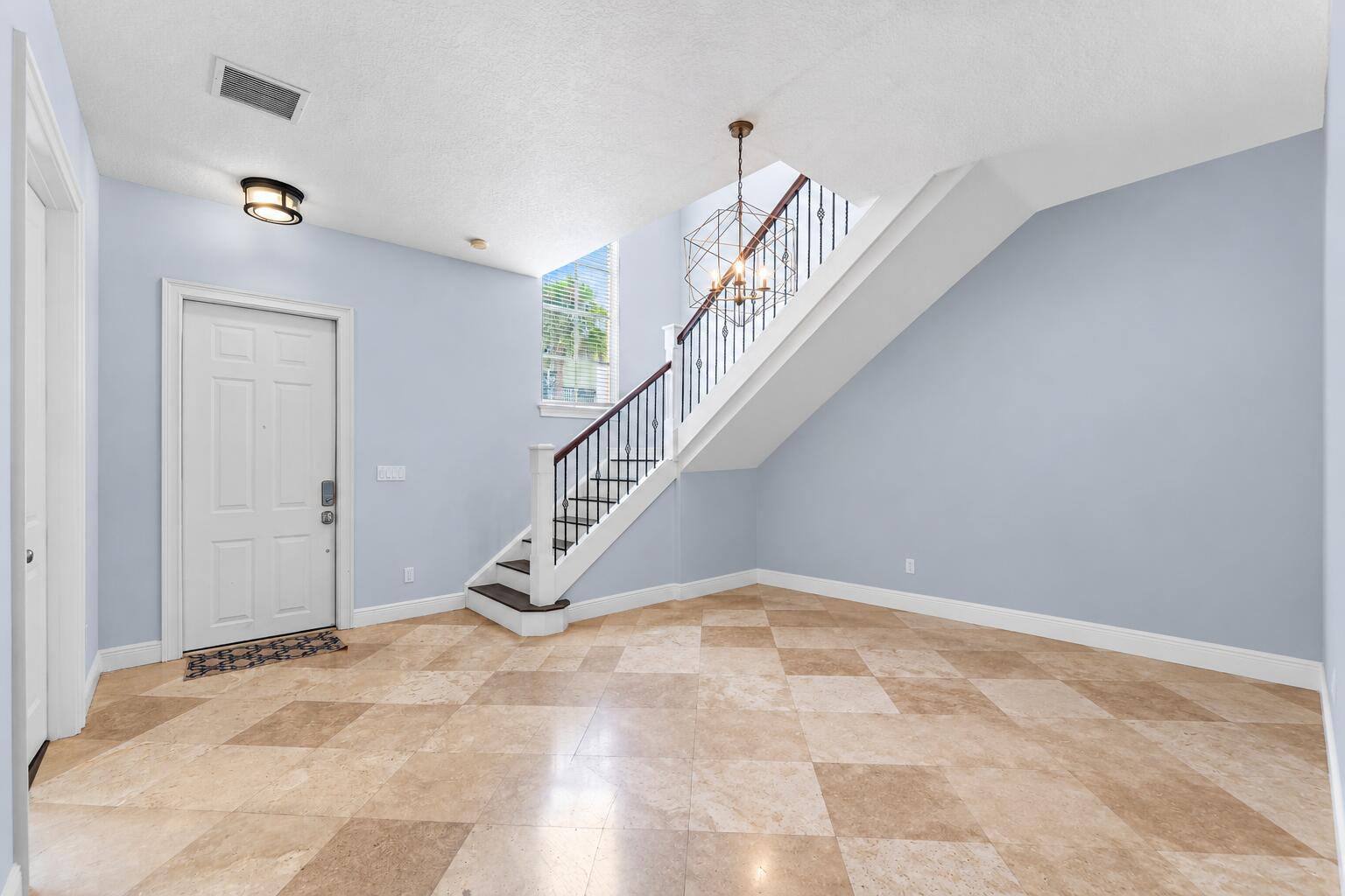 Airy Modern Foyer with Geometric Chandelier
