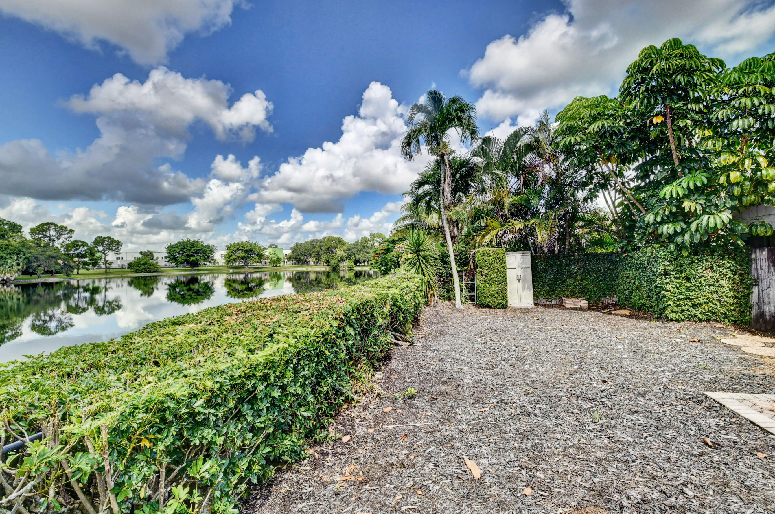 Private Outdoor Area with Mature Tropical Landscaping, Lush Greenery & Paved Walkway