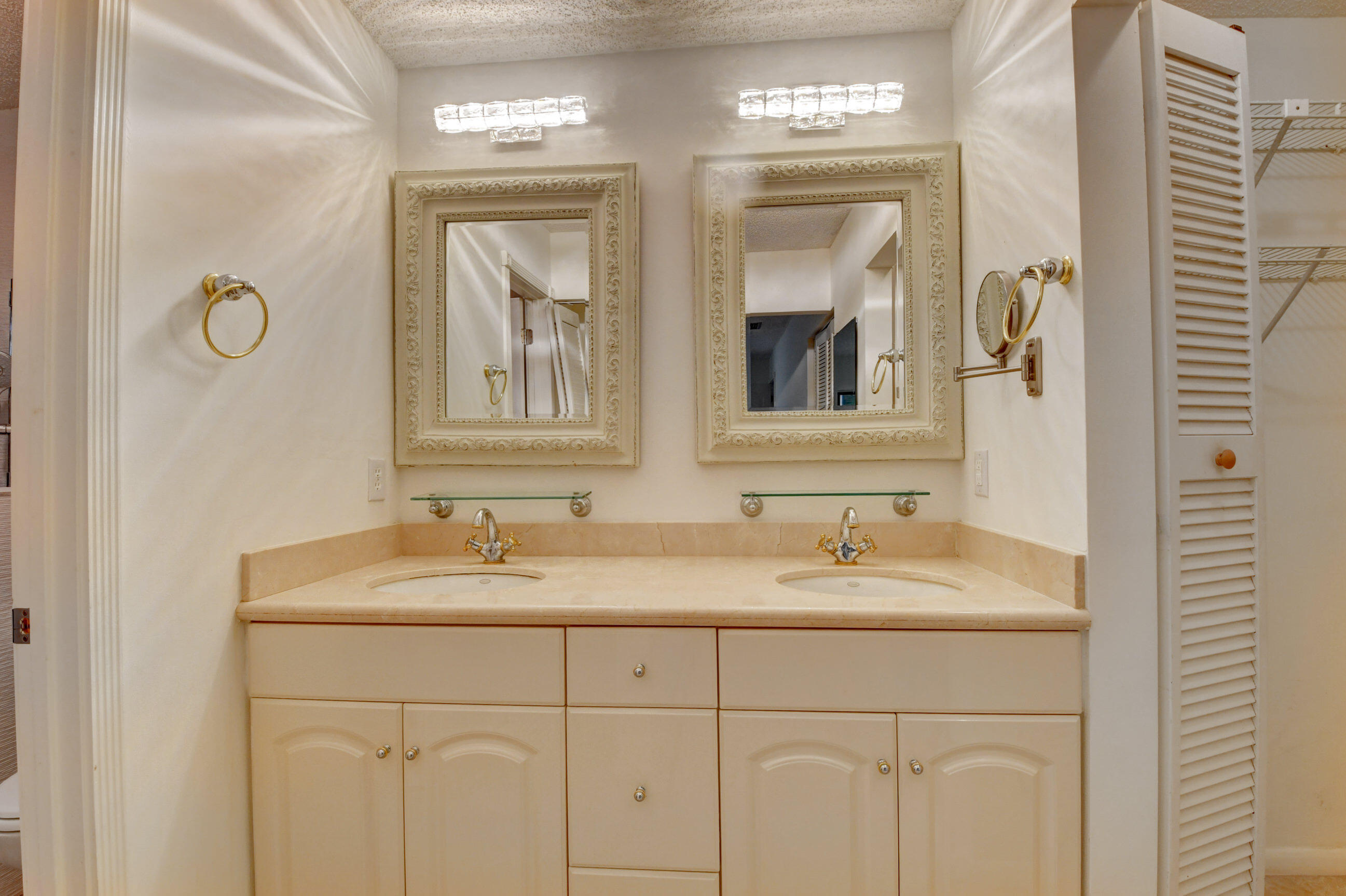 Elegant Primary Bathroom with Double Vanity, Framed Mirrors & Classic Cabinetry