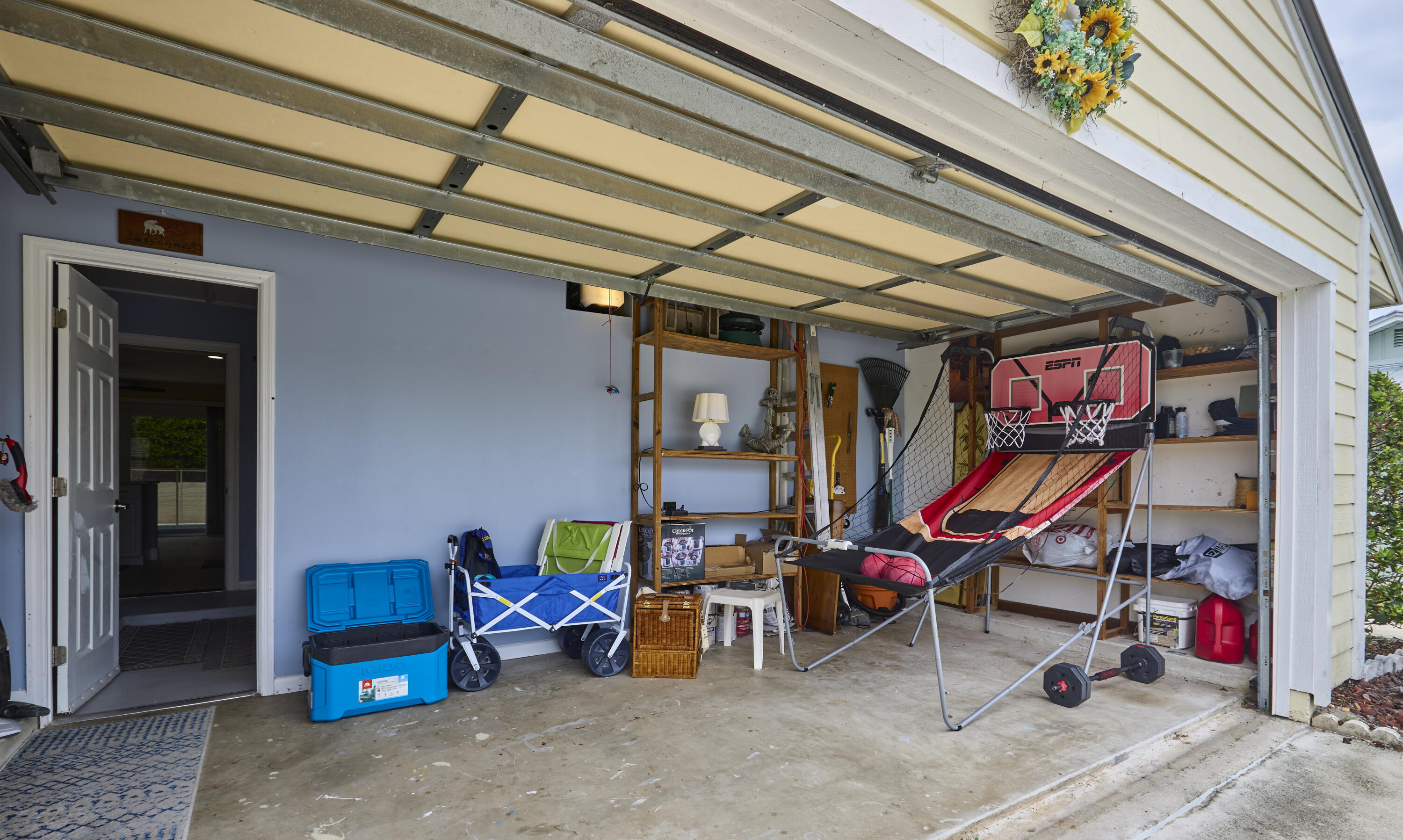 half of the garage is closed in with a window unit