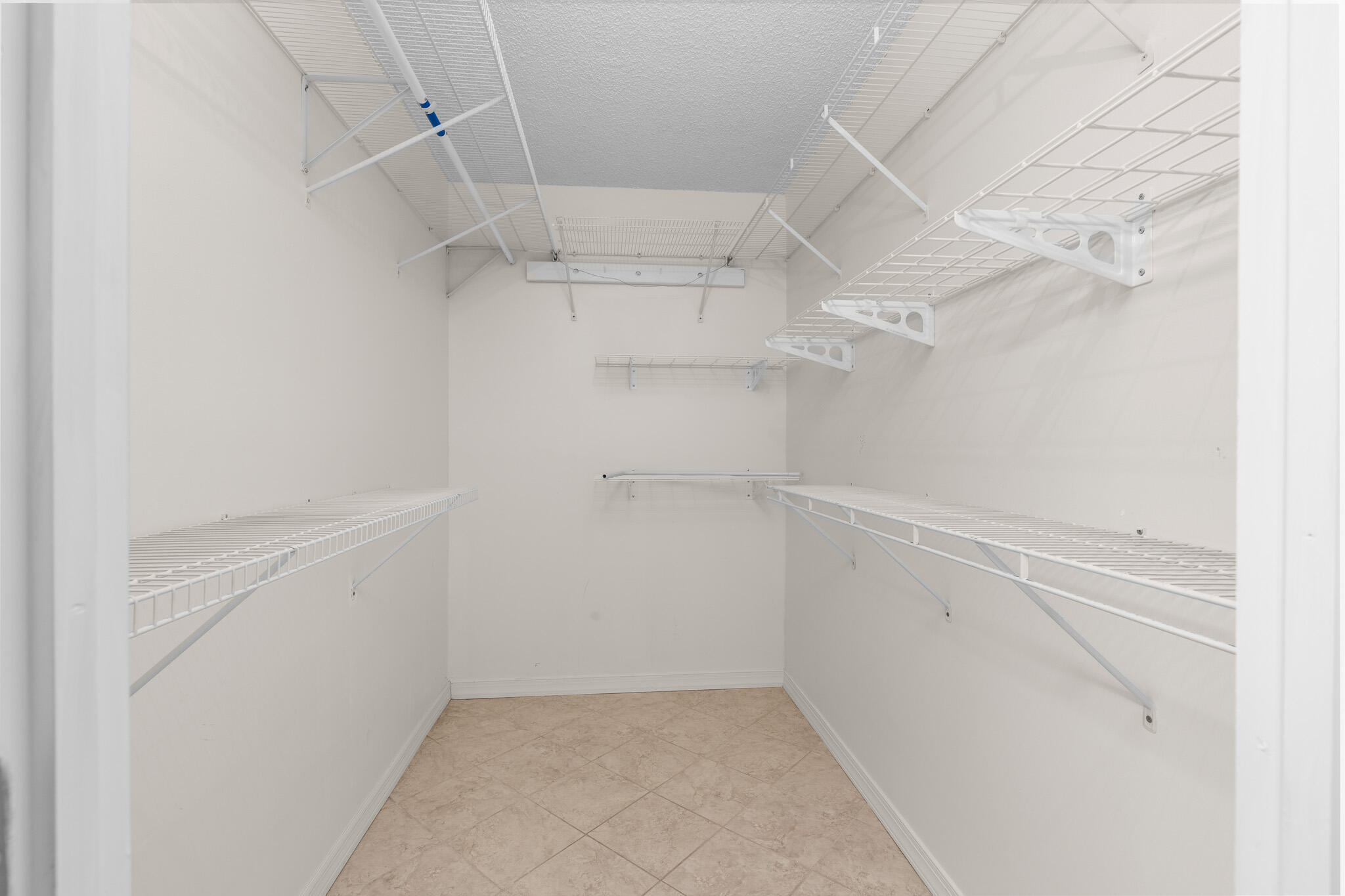 Oversized primary walk-in closet