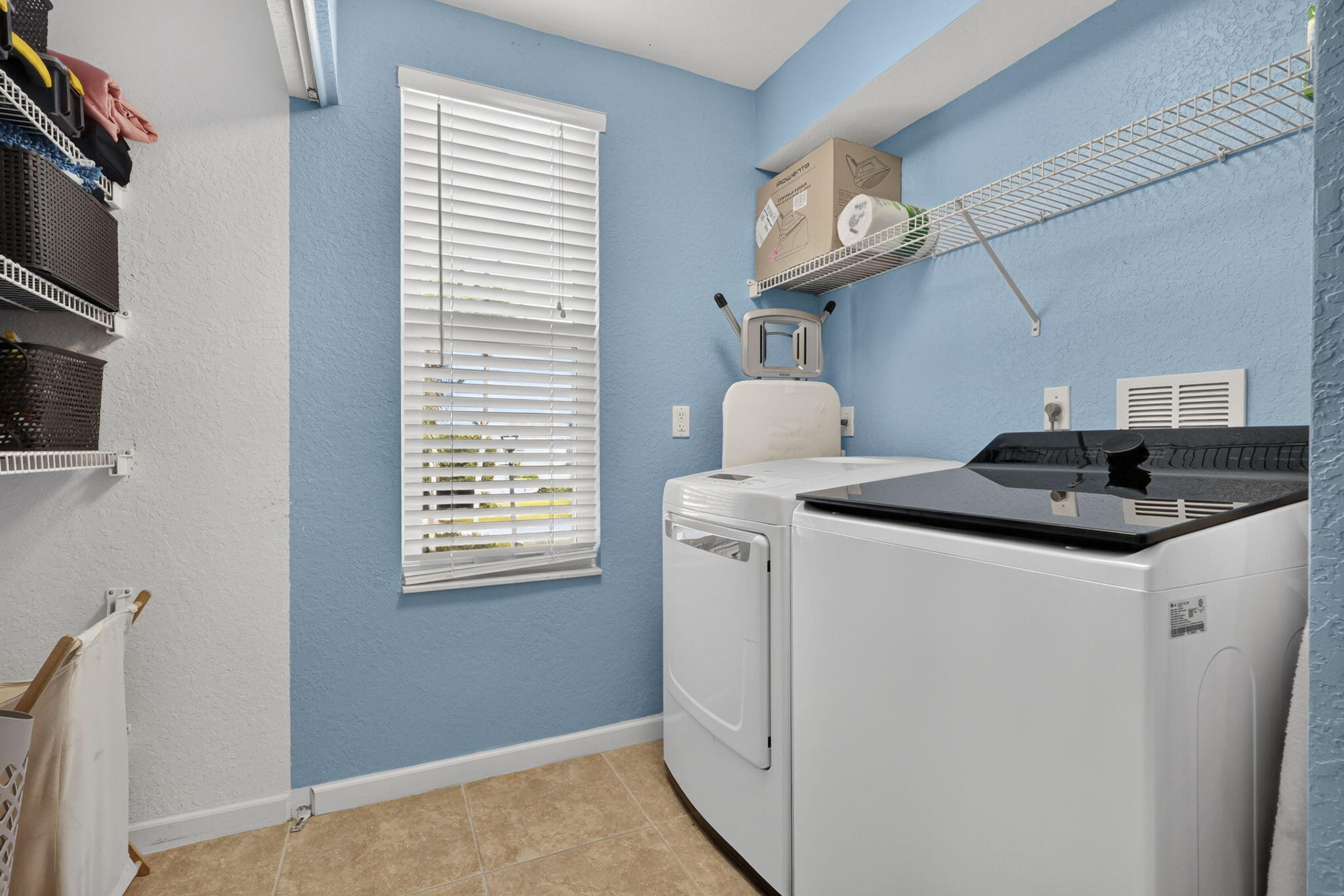 washer and dryer room with storage