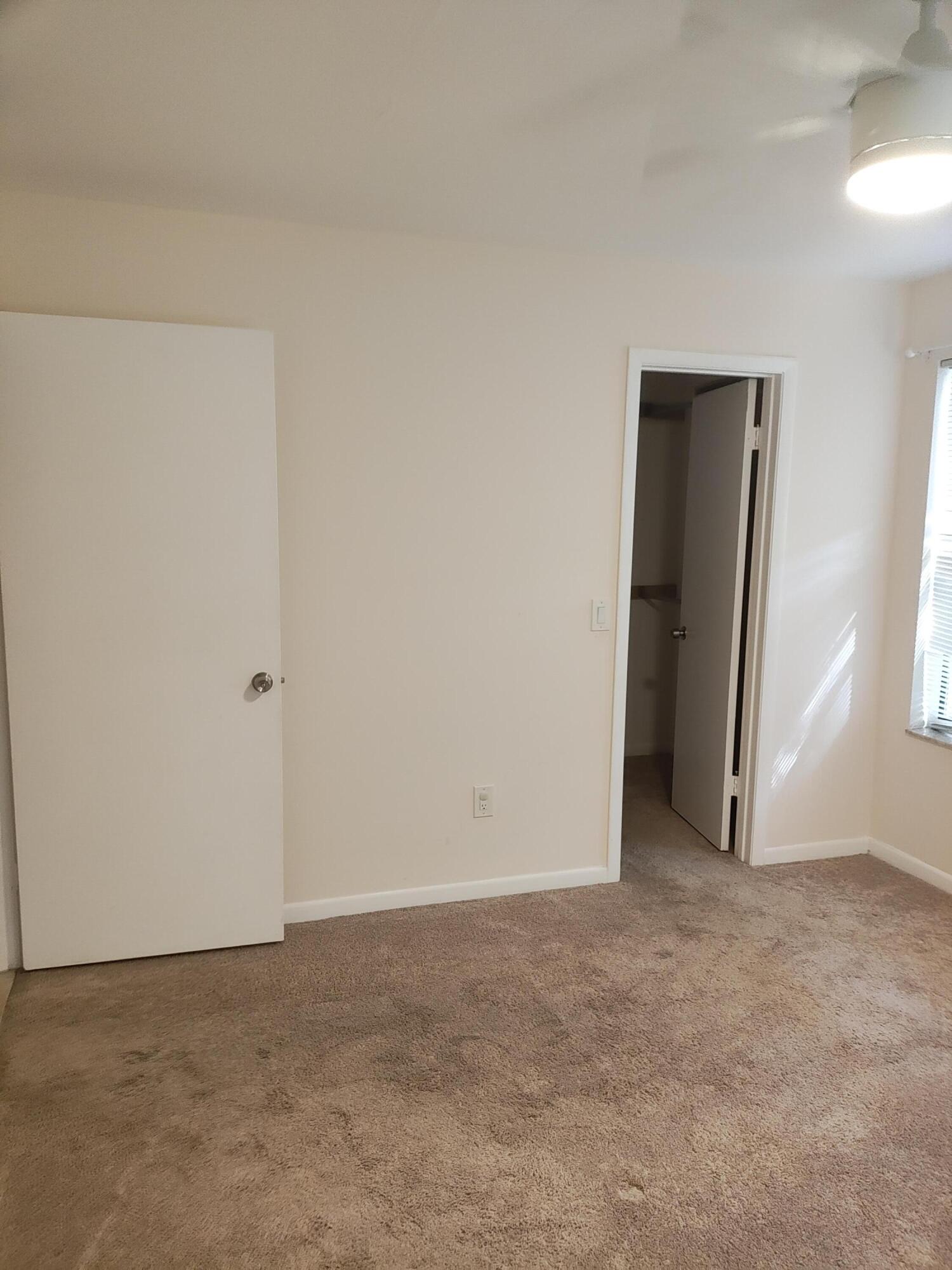 Bedroom with walk-in closet