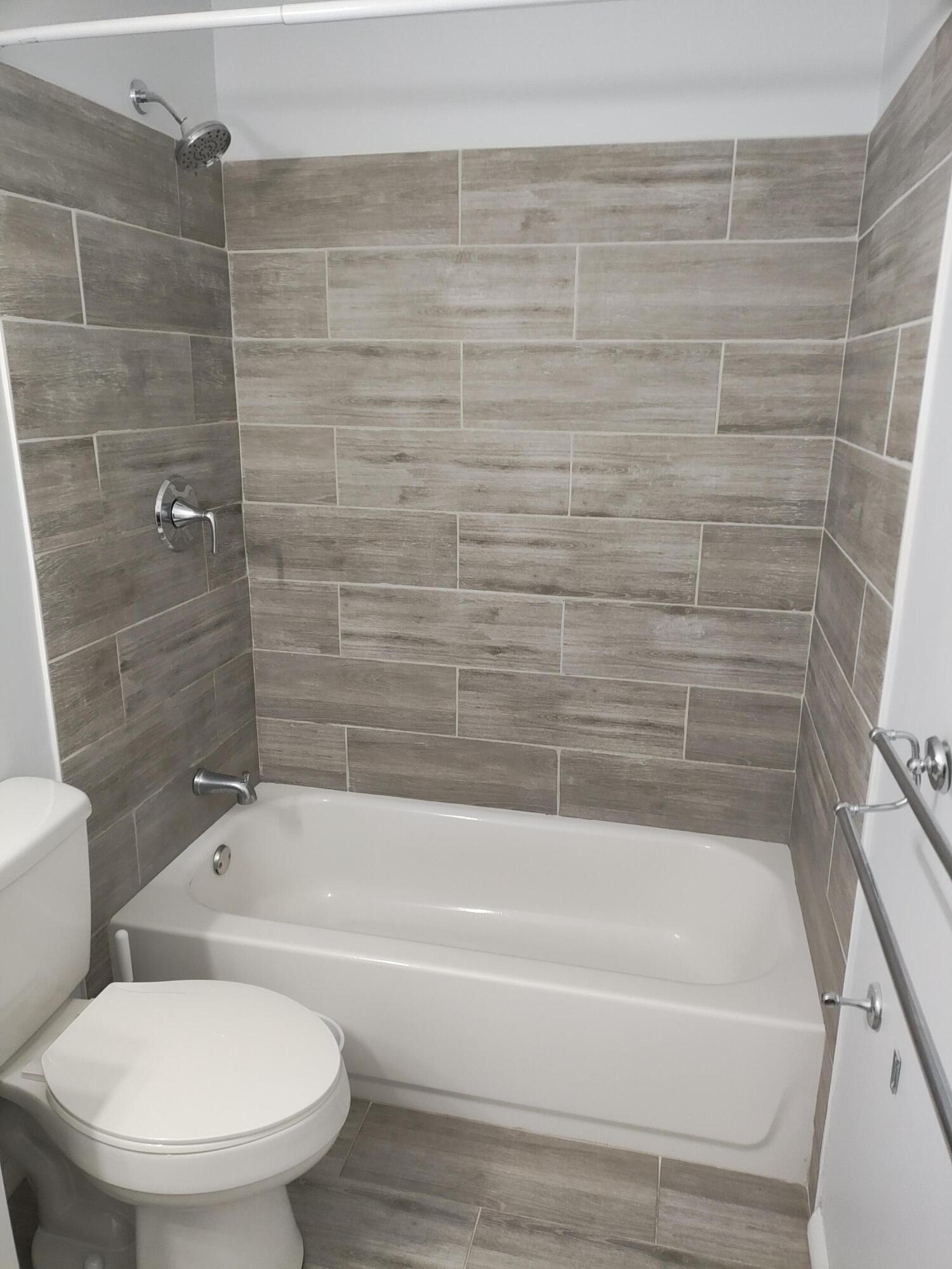 Newer tiled shower with tub