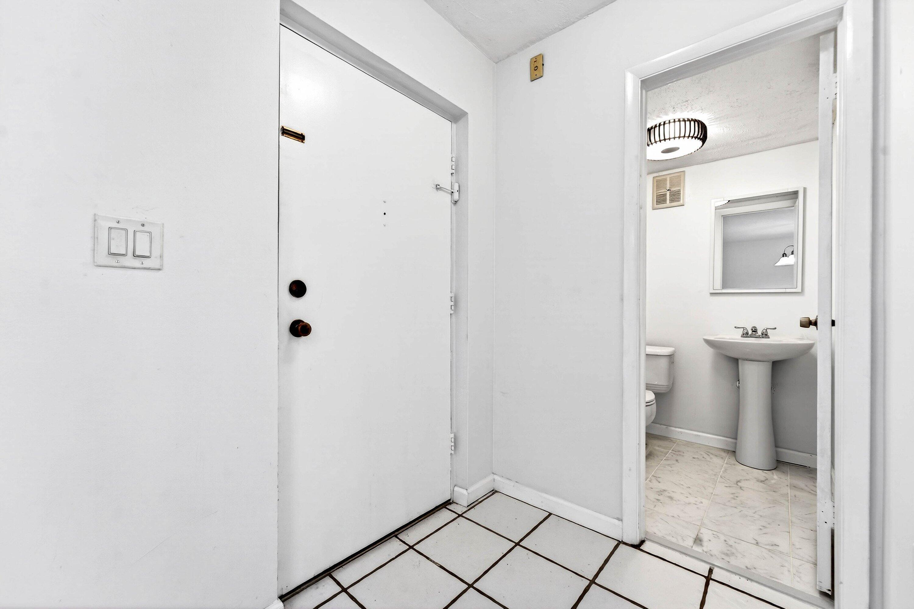 Condo entrance and half bathroom